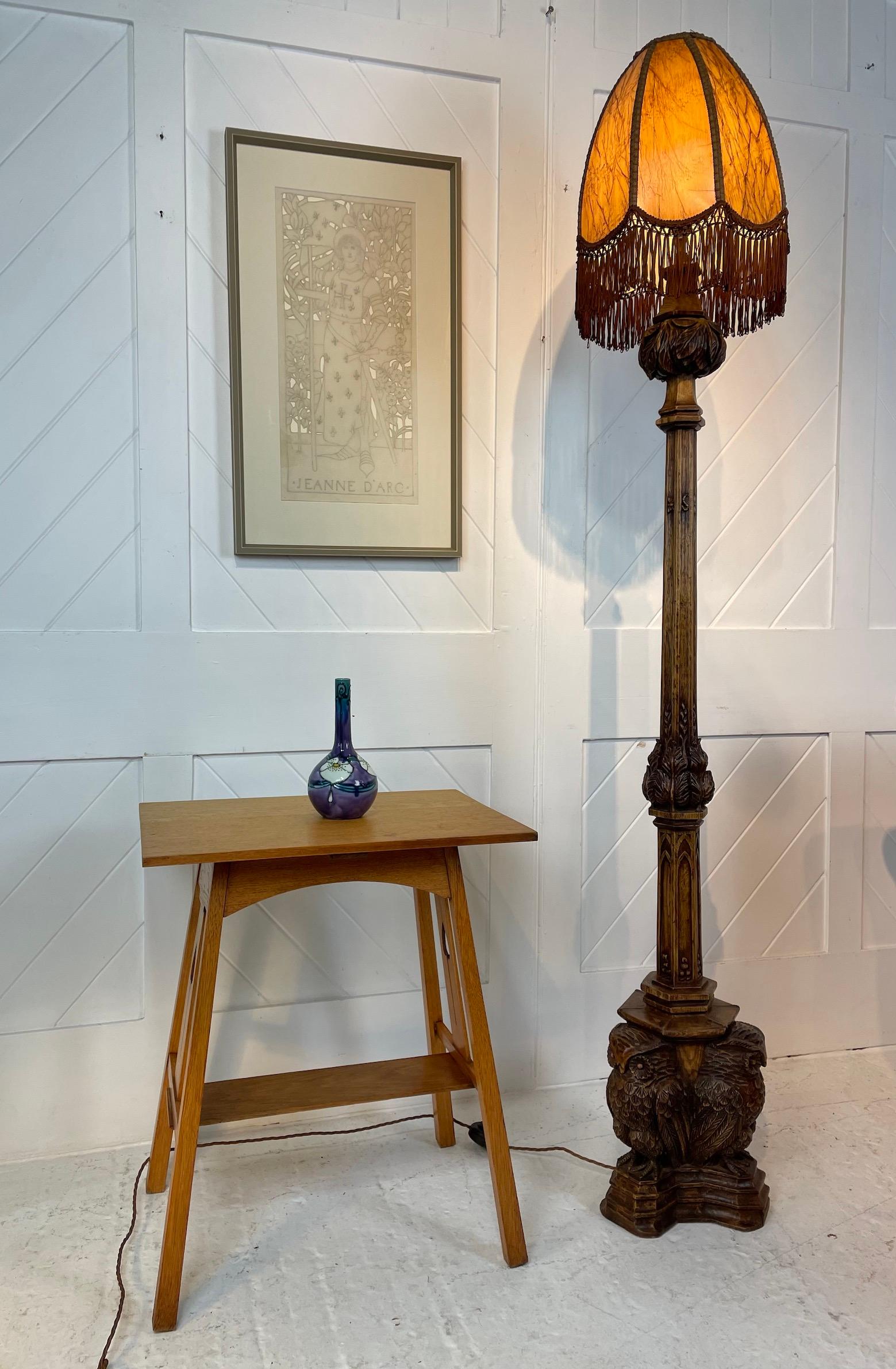 Fabulous carved oak standard lamp

The carving depicts stylised leaf design to the top and is further replicated on the stand

The column has carved insects around it

The base depicts 3 carved large owls standing on a plinth

It is in the manner of