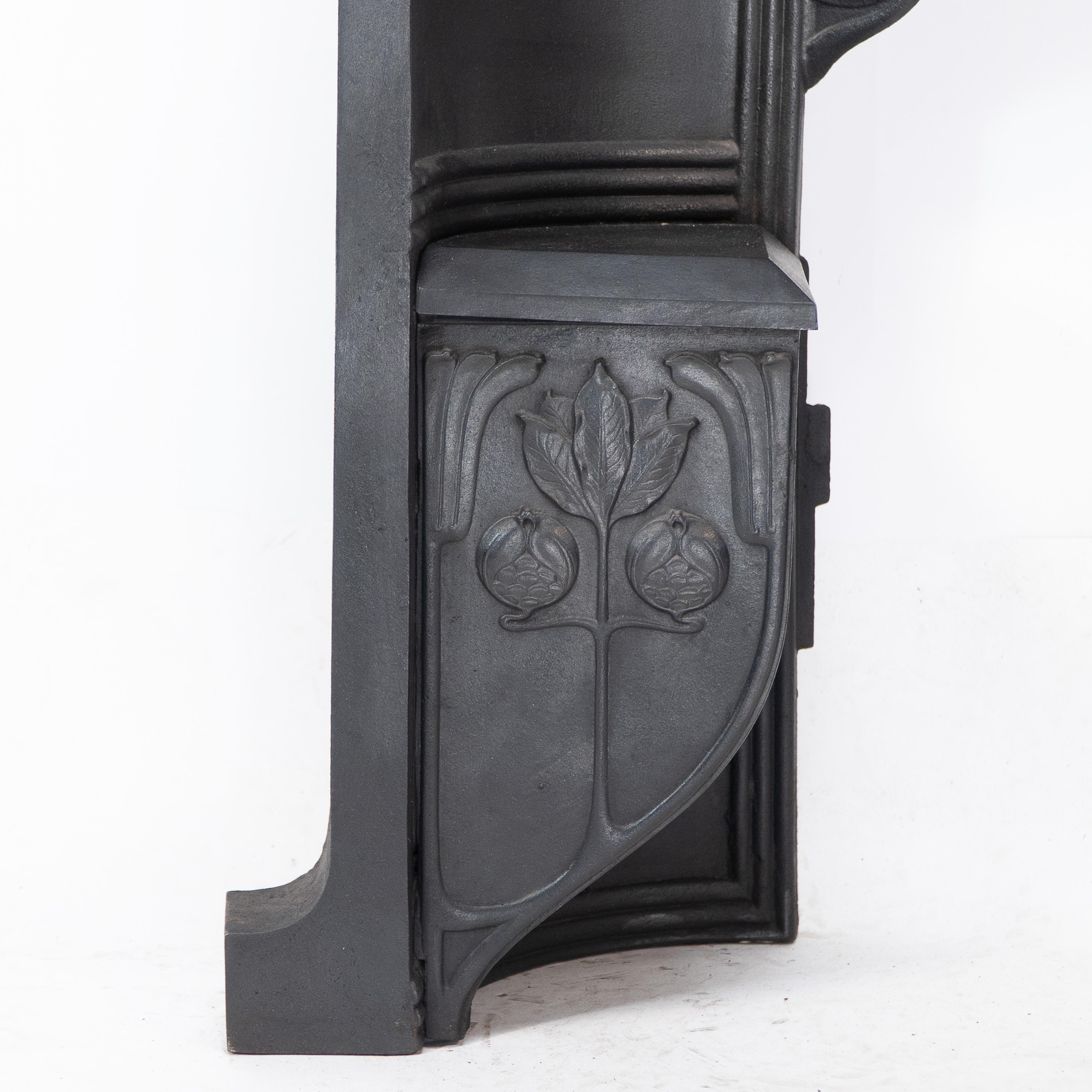 Arts & Crafts cast iron fireplace with curved sides & stylized floral decoration For Sale 4