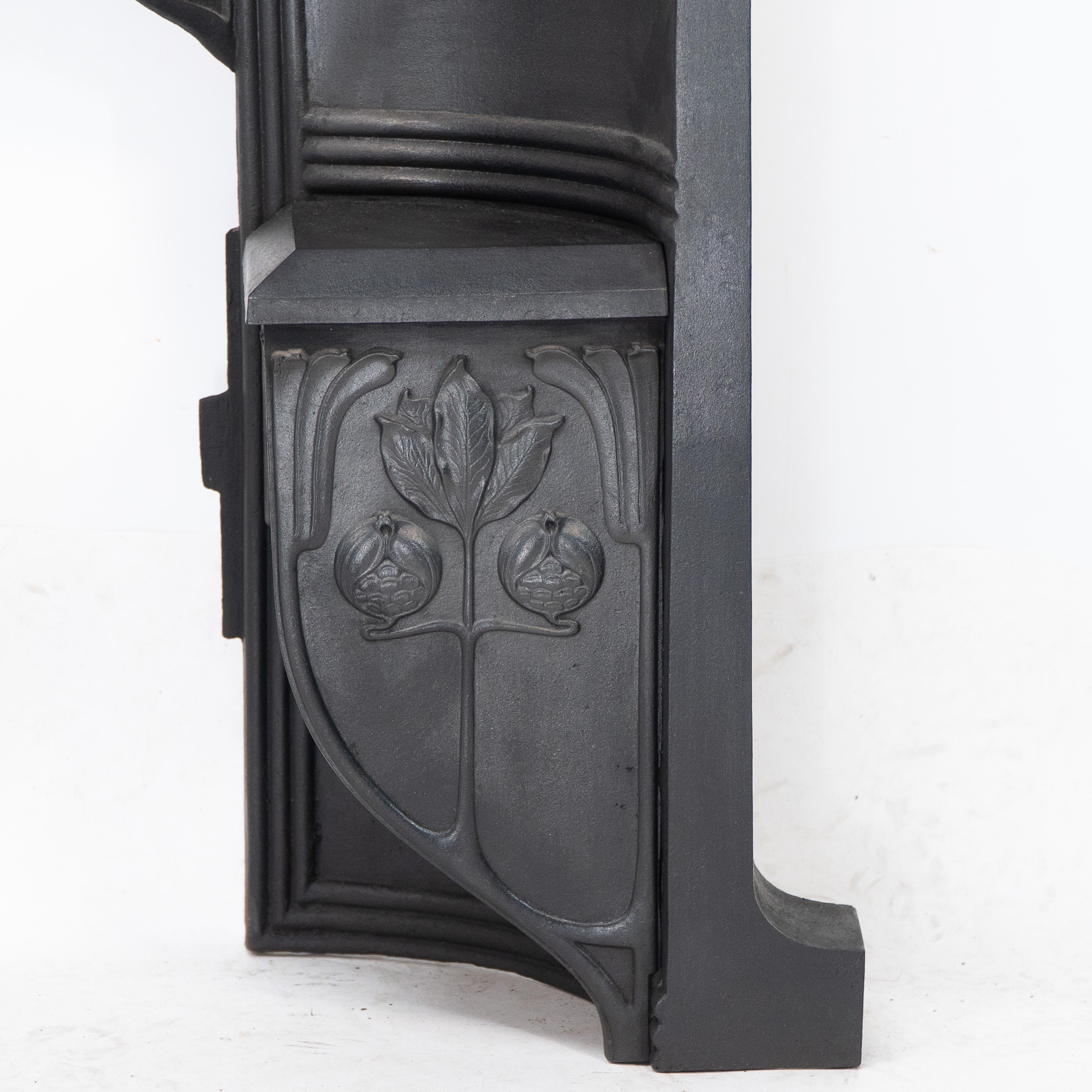 Arts & Crafts cast iron fireplace with curved sides & stylized floral decoration For Sale 7
