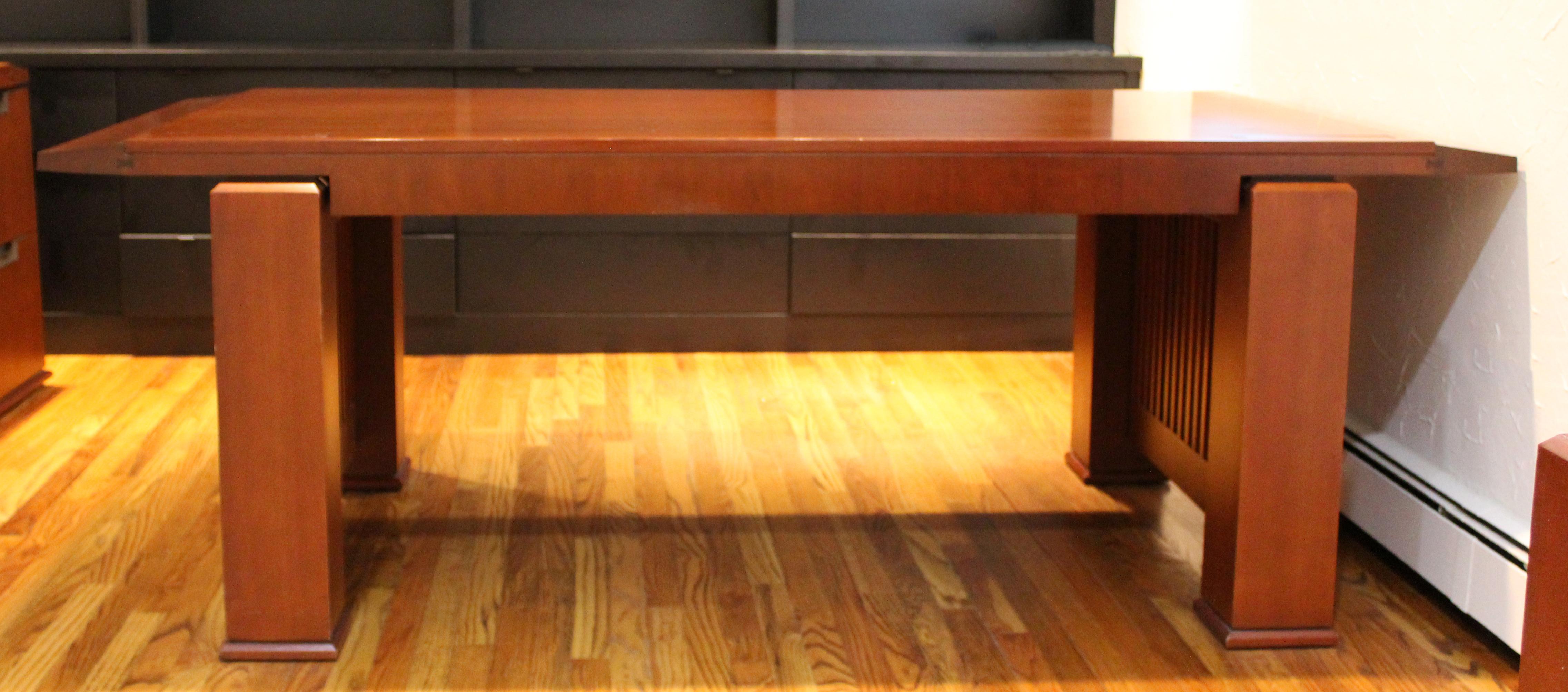 For your consideration is a magnificent, executive office desk, made of cherrywood, by Crofton International. Done in the Arts & Crafts style very reminiscent of Frank Lloyd Wright. In excellent condition. The dimensions are 84