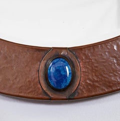 Espejo circular de cobre Arts and Crafts