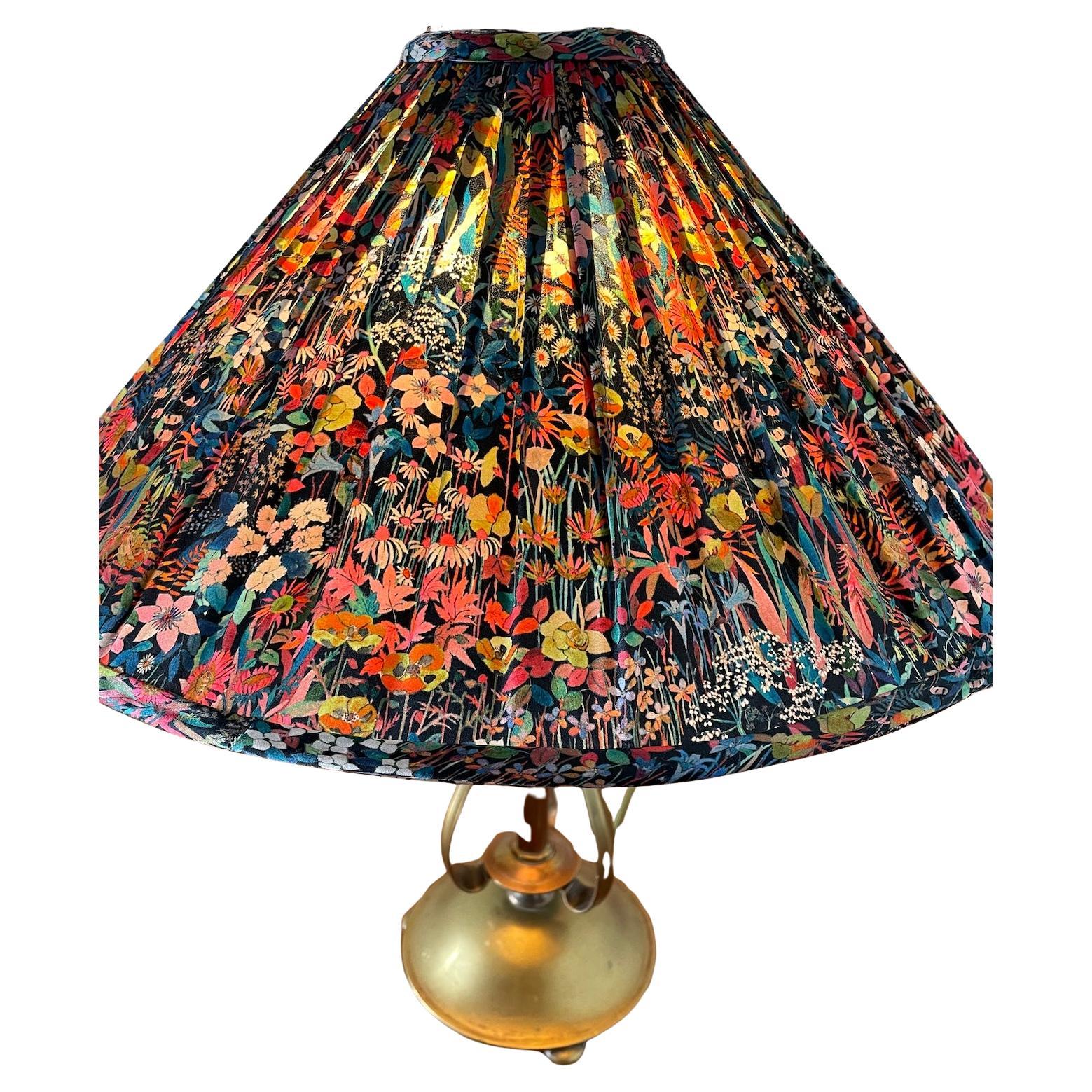 Arts & Crafts brass and copper table lamp

With silk shade ‘Faria Flowers’ fabric by Liberty, London

Hand made shade by Tinker & Tallulah for Patch Rogers Design 

Circa 1900

Height.  38cm  Diameter 16cm

With shade: Height 50cm.  Diameter 45cm