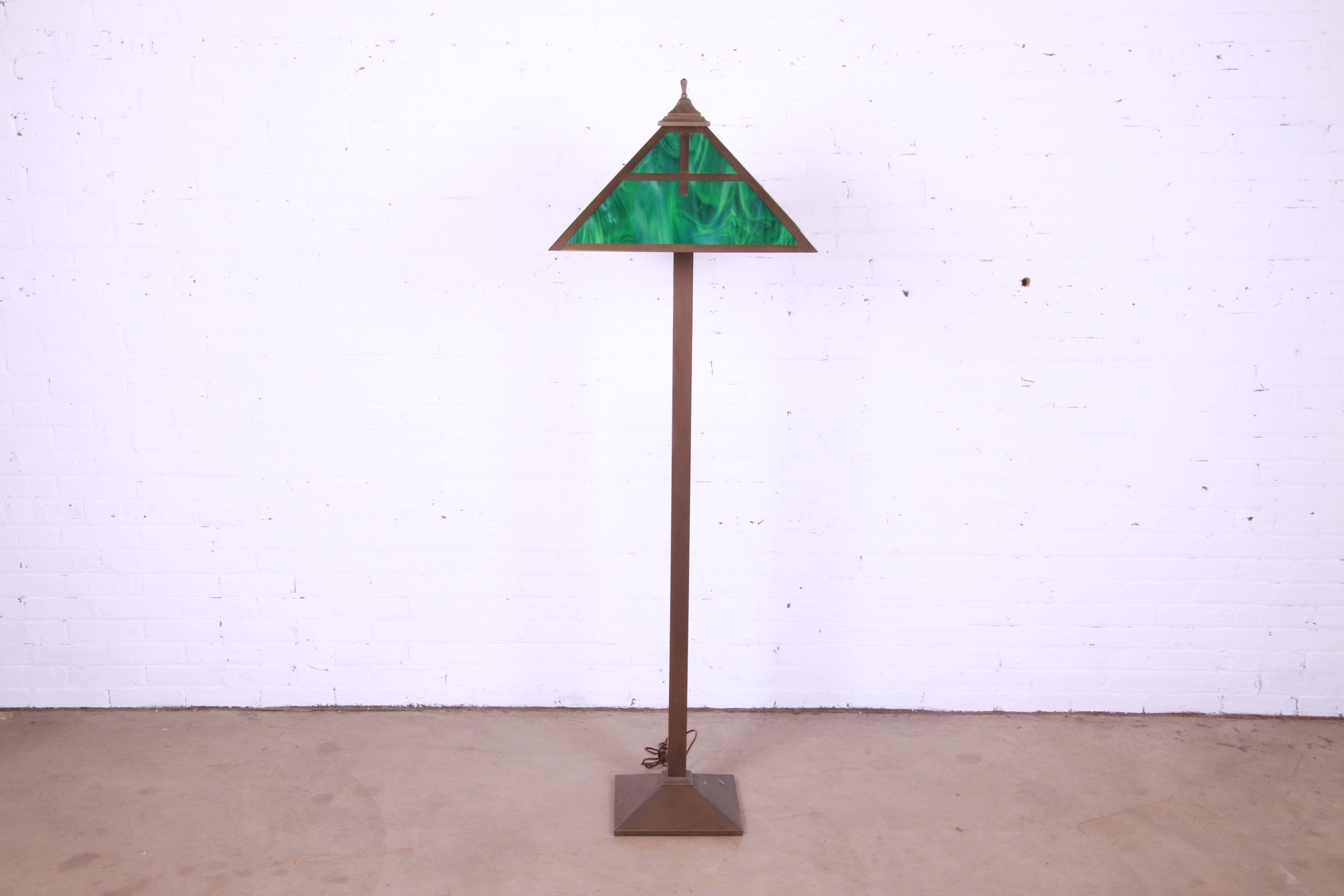 A beautiful Arts & Crafts style floor lamp

Recently procured from Frank Lloyd Wright's DeRhodes House

USA, late 20th century

Copper, with green slag glass shade.

Measures: 22