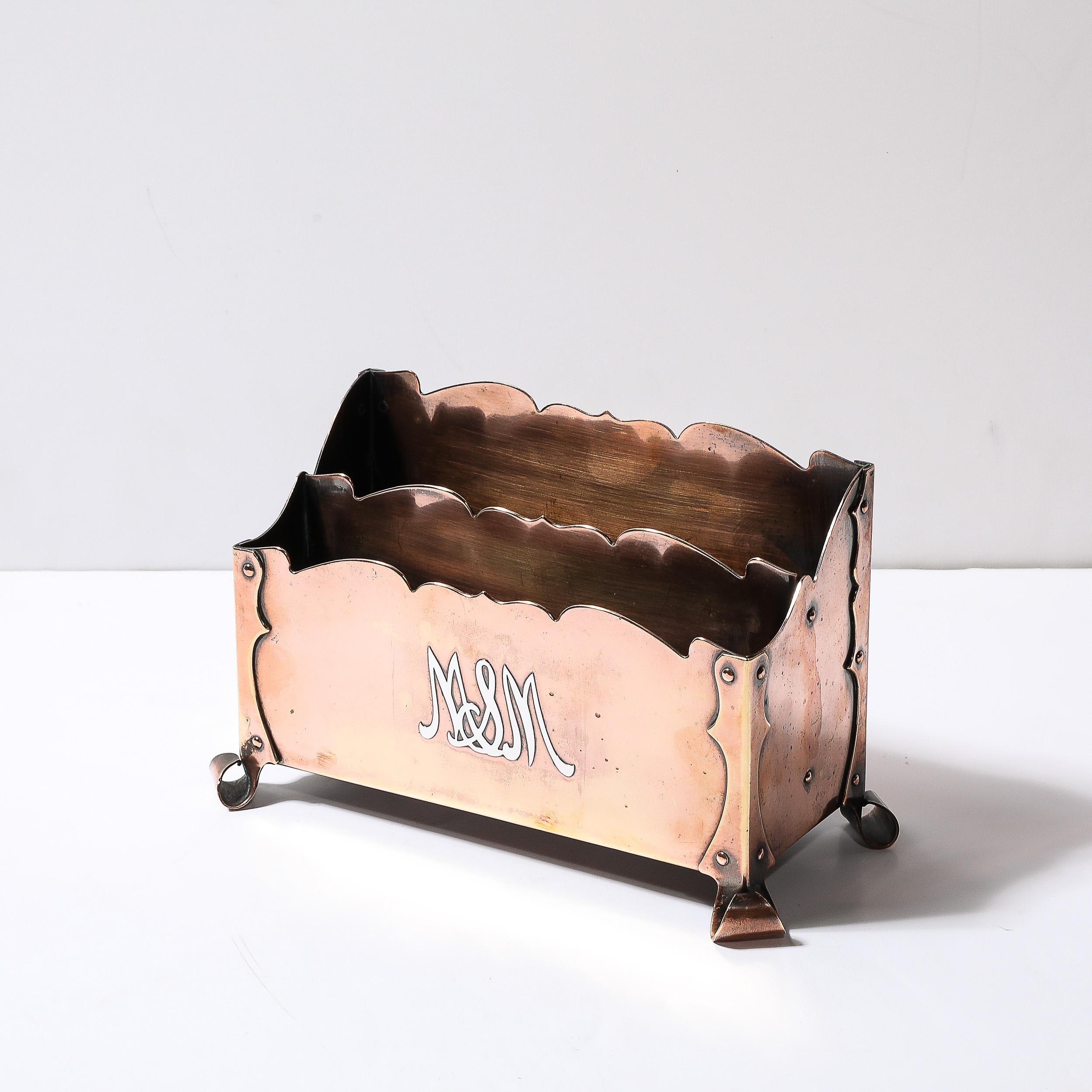 This unique a elegantly detailed Arts and Crafts Copper and Sterling Silver Letter Holder originates from the United States, Circa 1910. Features a seriffed geometric composition in copper fitted with rivets and utilizing the overlaps in the