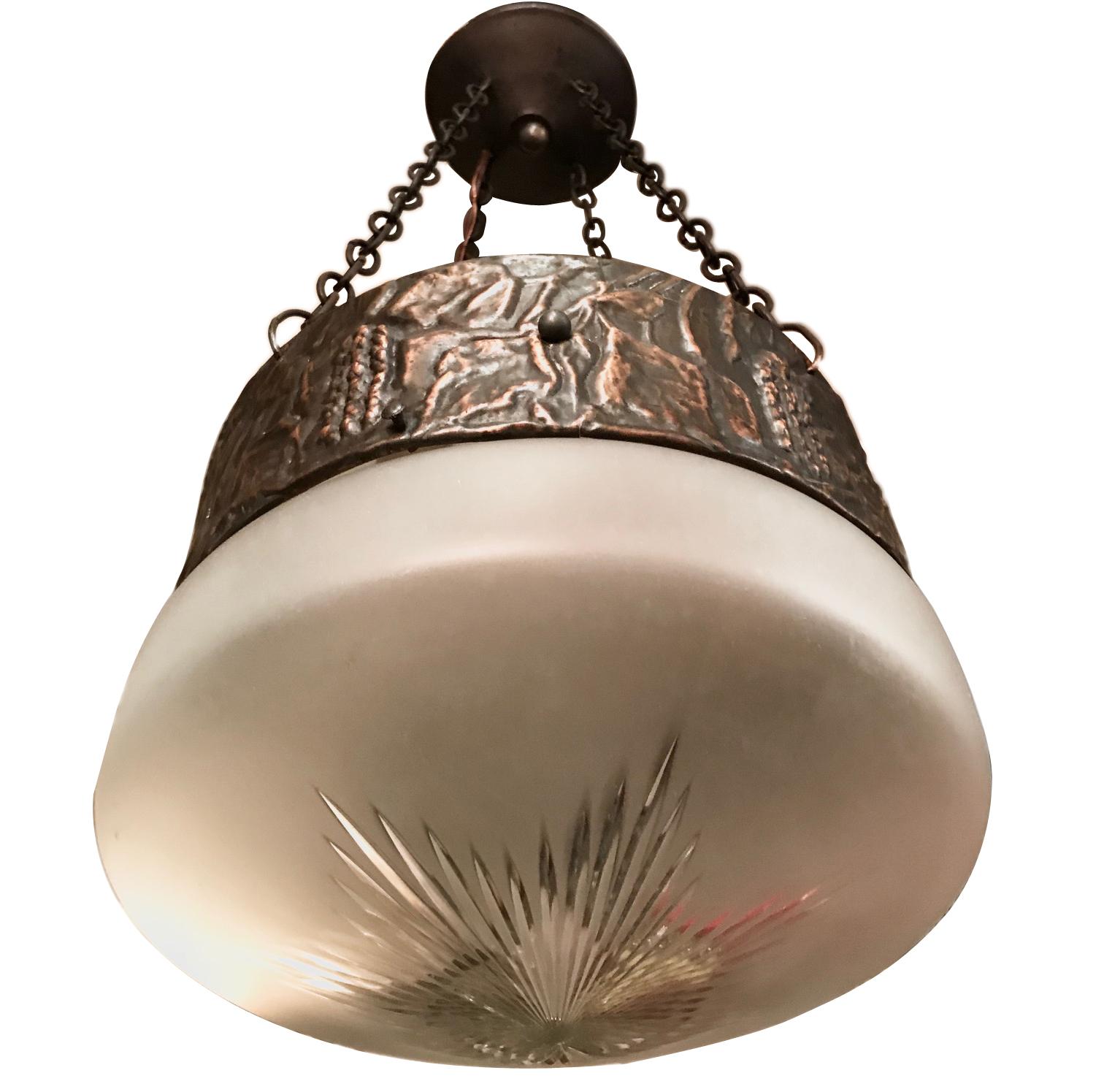 A circa 1930's Danish Arts & Crafts style ceiling fixture with hammered copper body and glass inset.

Measurements:
Diameter: 9.5