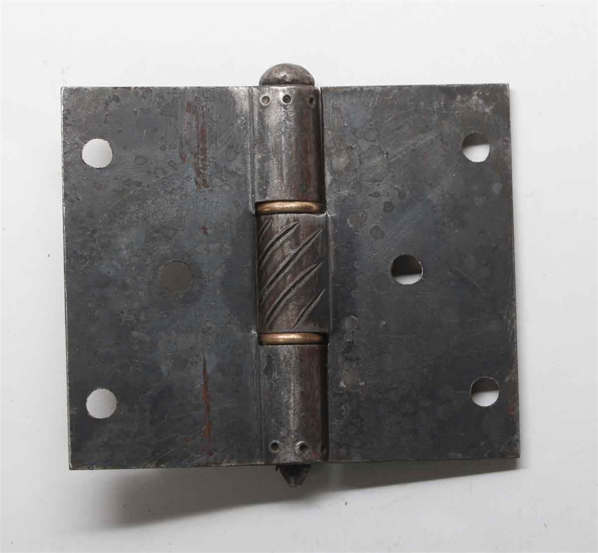 These are original ornamental hand forged iron door hinges attributed to Samuel Yellin. Each hinge is decorated with lines on the edges and brass washers. These Arts & Crafts hinges were salvaged from the La Tourelle Home in Fox Chapel, PA. The