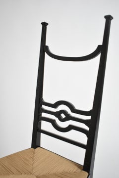 Arts & Crafts ebonised wood fireside chair, 1900s