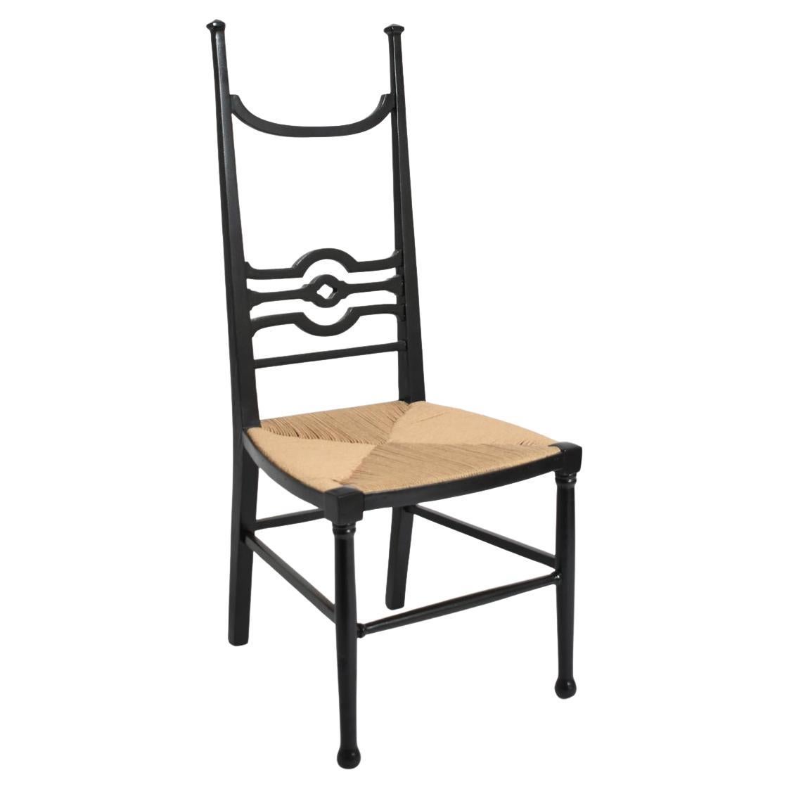Arts & Crafts ebonised wood fireside chair, 1900s