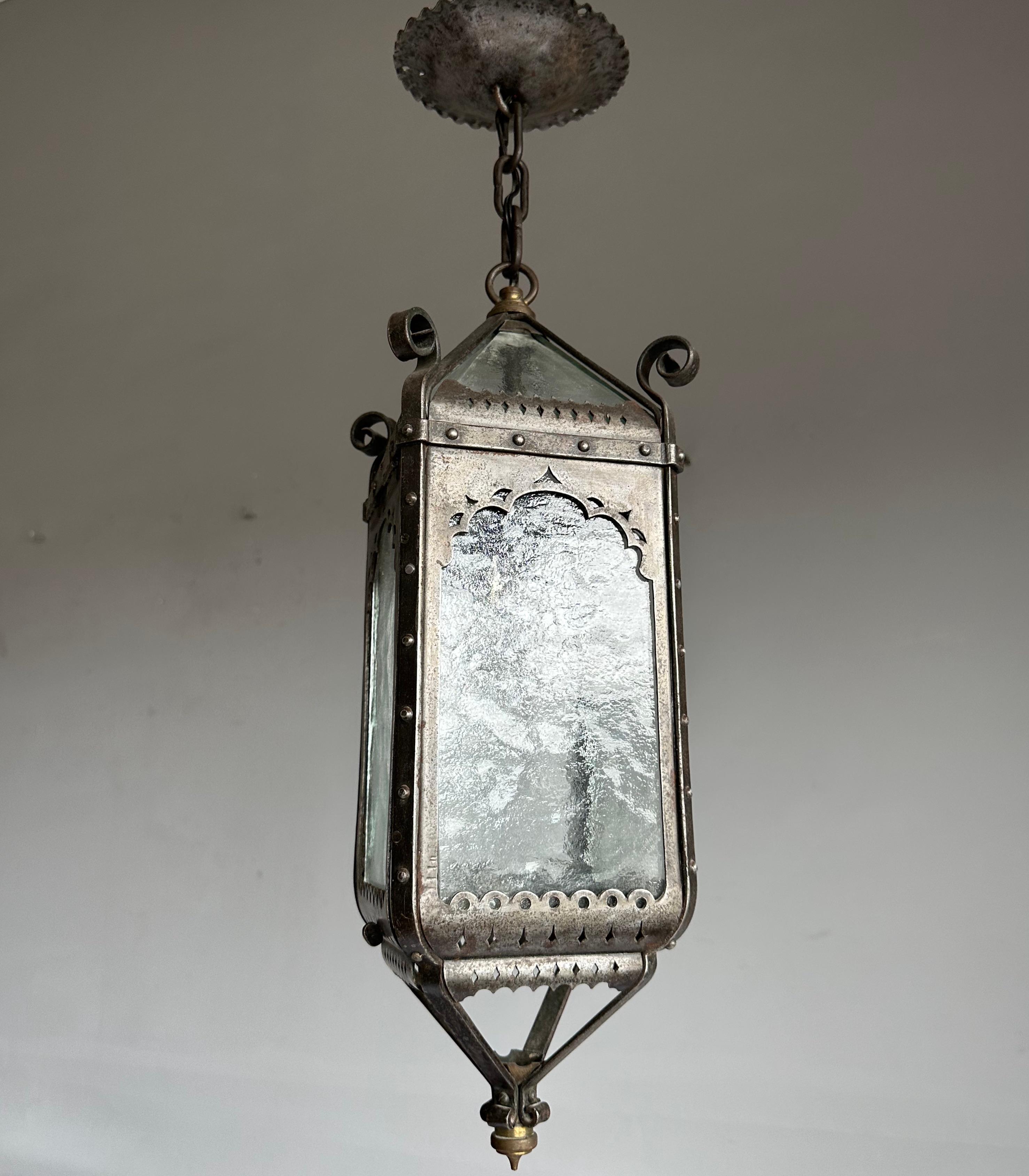 Finer quality and all handcrafted, tall entry hall light fixture.

With early 20th century lighting as one of our specialities, we are always happy to find a pendant, lantern or chandelier that we have never seen before. This Medieval Style lantern