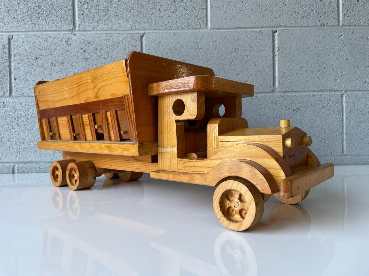 Unique Wood Coal truck hand-carved with movable hopper doors. Expertly crafted and signed by F.M. Arts & Crafts. Great for a toy collection, display, or a general wooden home decor element. Handcrafted from different woods.

In great vintage