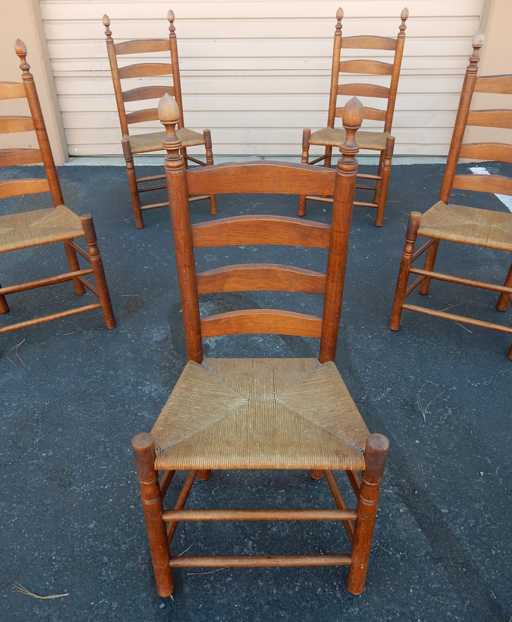Finely crafted and aged set of 5 early 1900s
dining chairs with tall ladder backs and rush seating.
These are not restored and retain their original aged patina.
No repairs or issues.