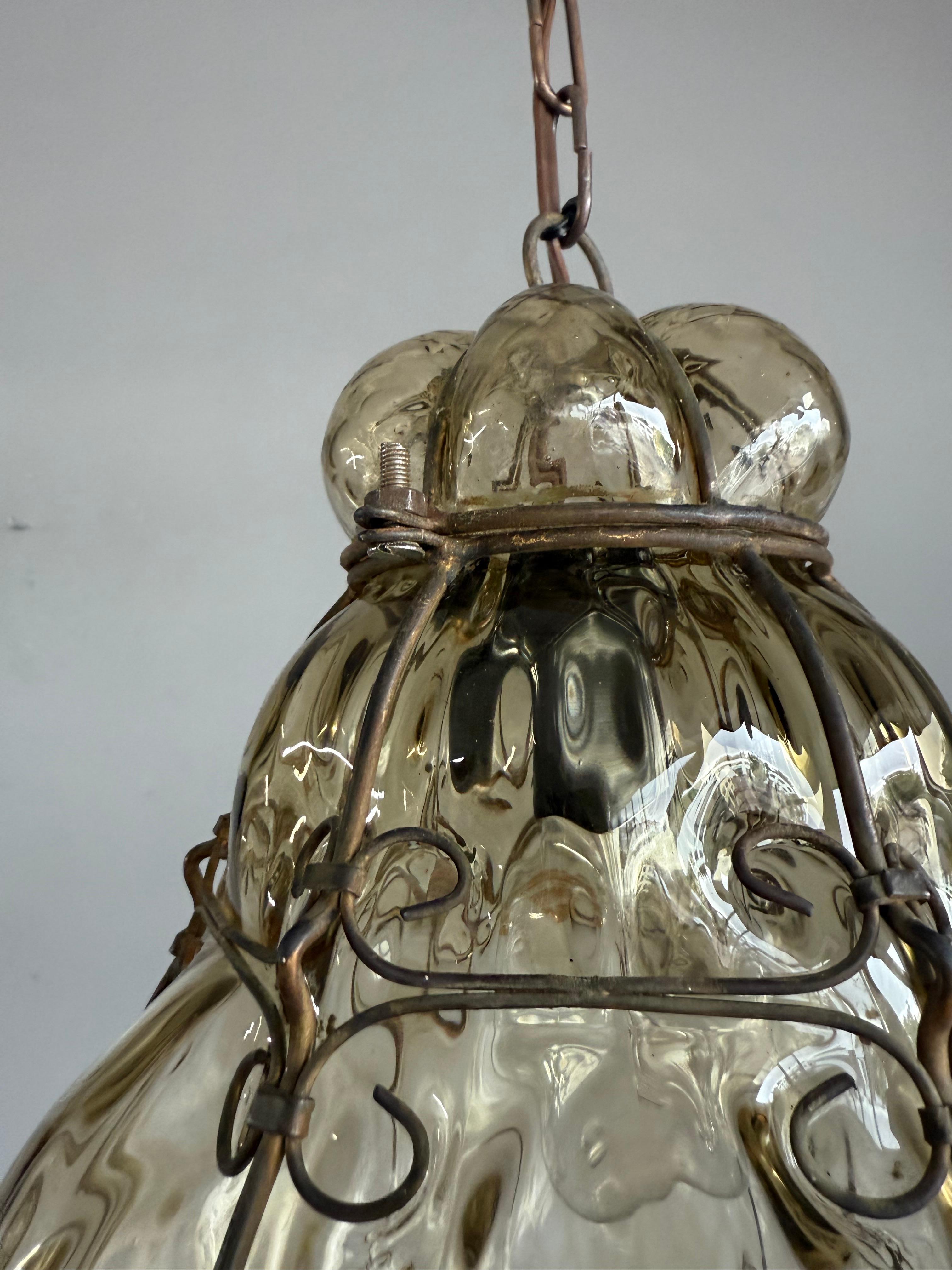 Brass Arts & Crafts Era Venetian Pendant Light of Mouthblown Glass into an Iron Frame For Sale