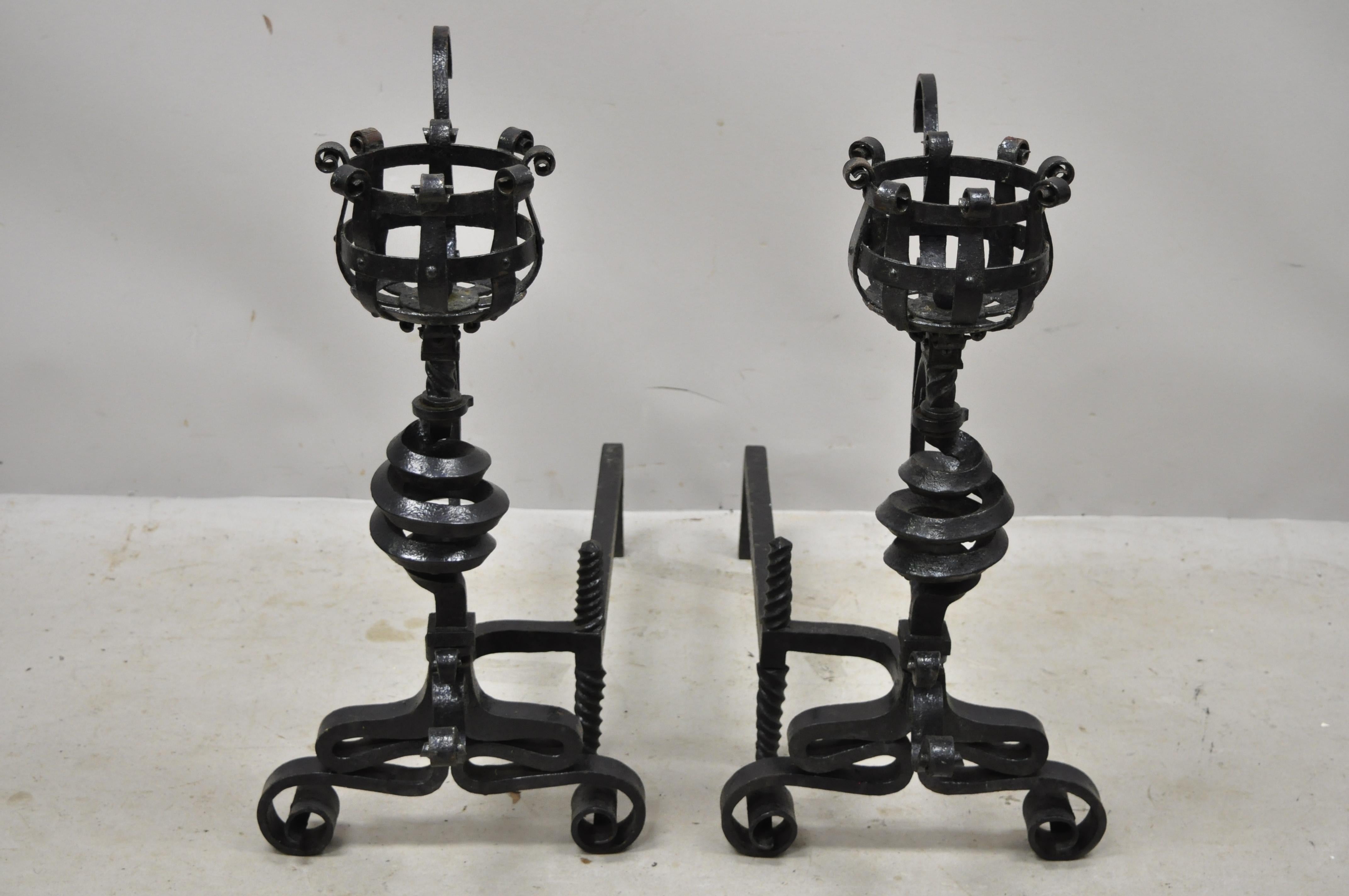 Antique Arts & Crafts Gothic cast iron spiral scrollwork fireplace andirons, a pair. Item features swing out arm/pot holders, ornate scrolling frame, spiral form body, cast iron construction, very nice antique item, quality craftsmanship,
circa