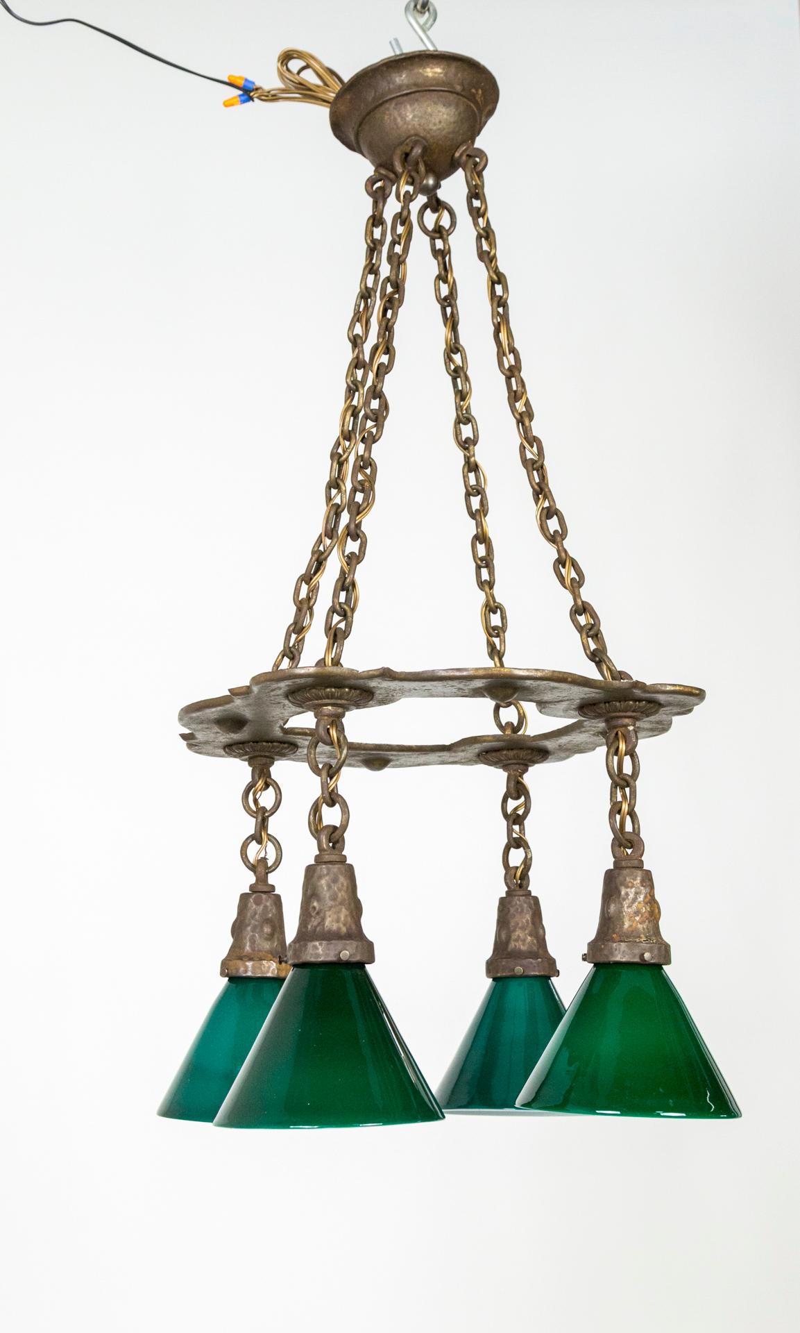 20th Century Arts & Crafts Hammered Darkened Metal Chandelier with Green Glass Shades For Sale