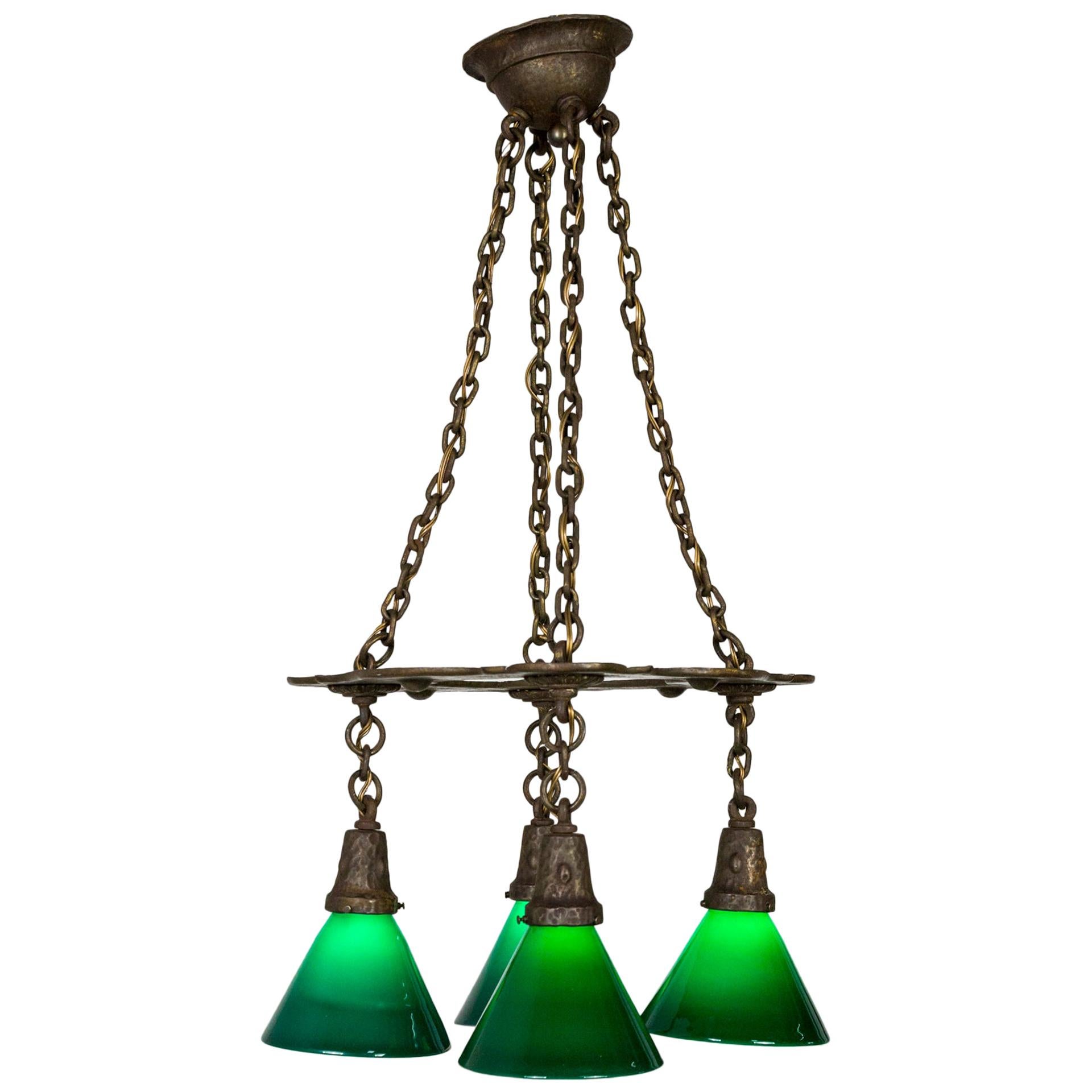 Arts & Crafts Hammered Darkened Metal Chandelier with Green Glass Shades For Sale