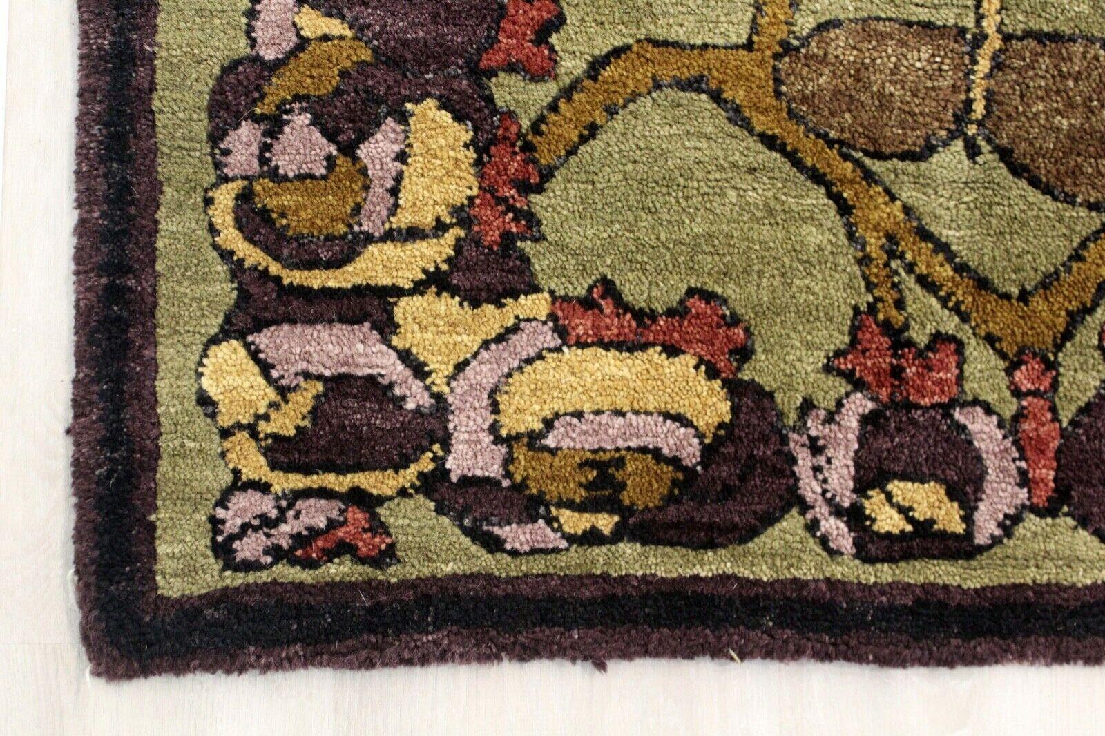 This Arts & Crafts style area rug combines traditional colors and flower rosettes ranging in reds, greens and browns. Simply stunning, this rug is 100% hand spun in Nepal by Tufenkian Luxury Rugs.

Dimensions: 8' x 10'.