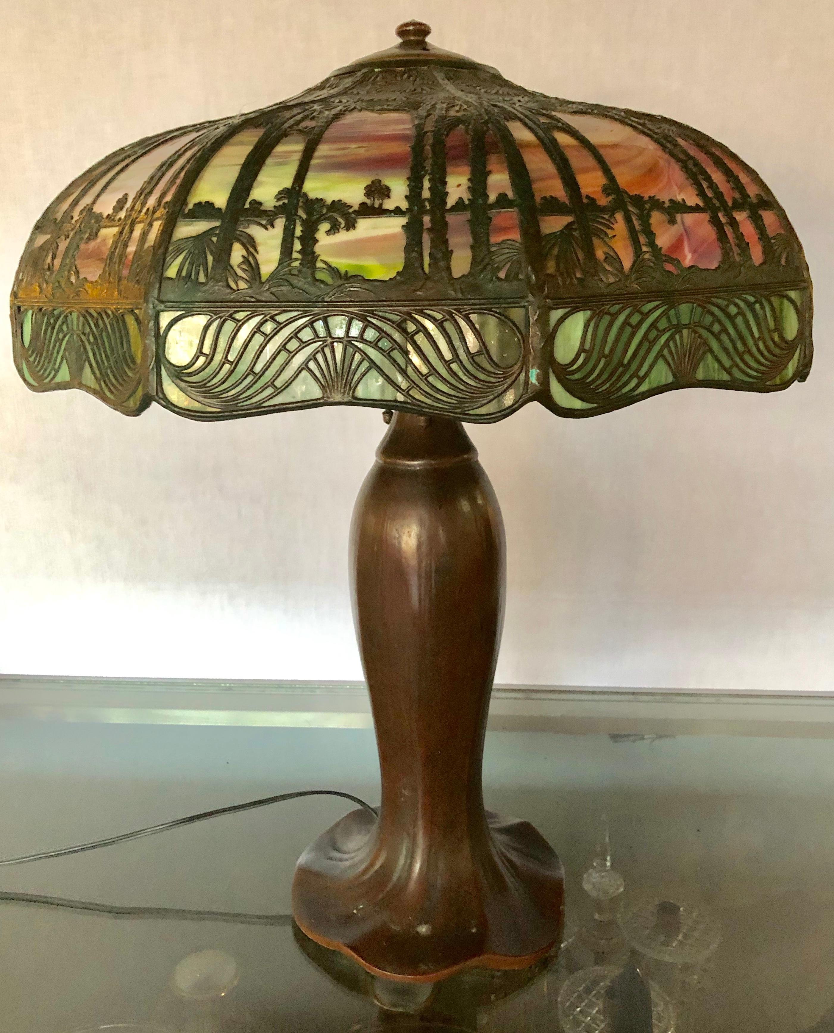Handel palm tree table lamp signed on base and shade Art & Crafts.

The shade measures 7.5