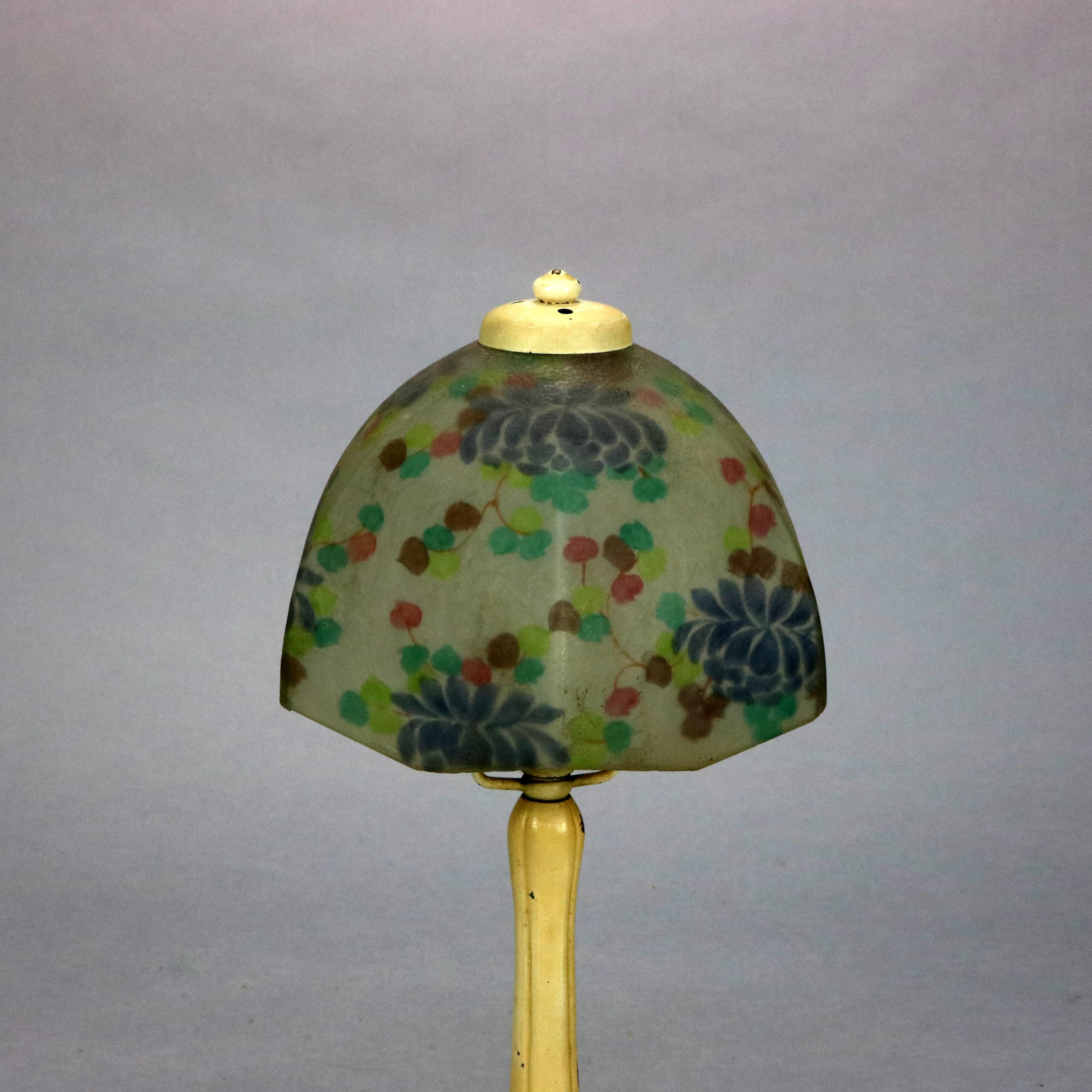 An antique Arts & Crafts boudoir table lamp by Handel offers reverse floral painted shade over single socket base, signed 