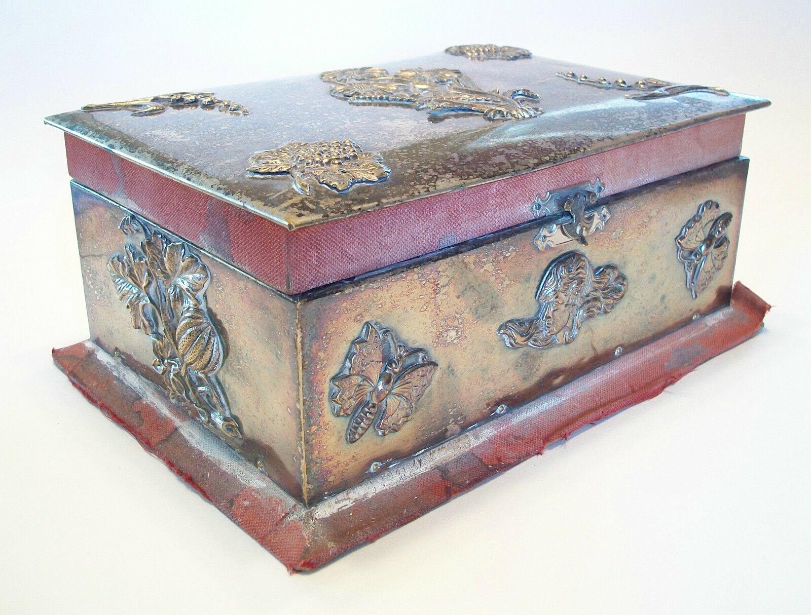 Antique Arts & Crafts metal clad jewelry box with applied decoration - remnants of velvet trim - silk lining - unsigned - United Kingdom (likely) - circa 1880.

Poor antique condition - surface scratches and minor dents that come with age and use -