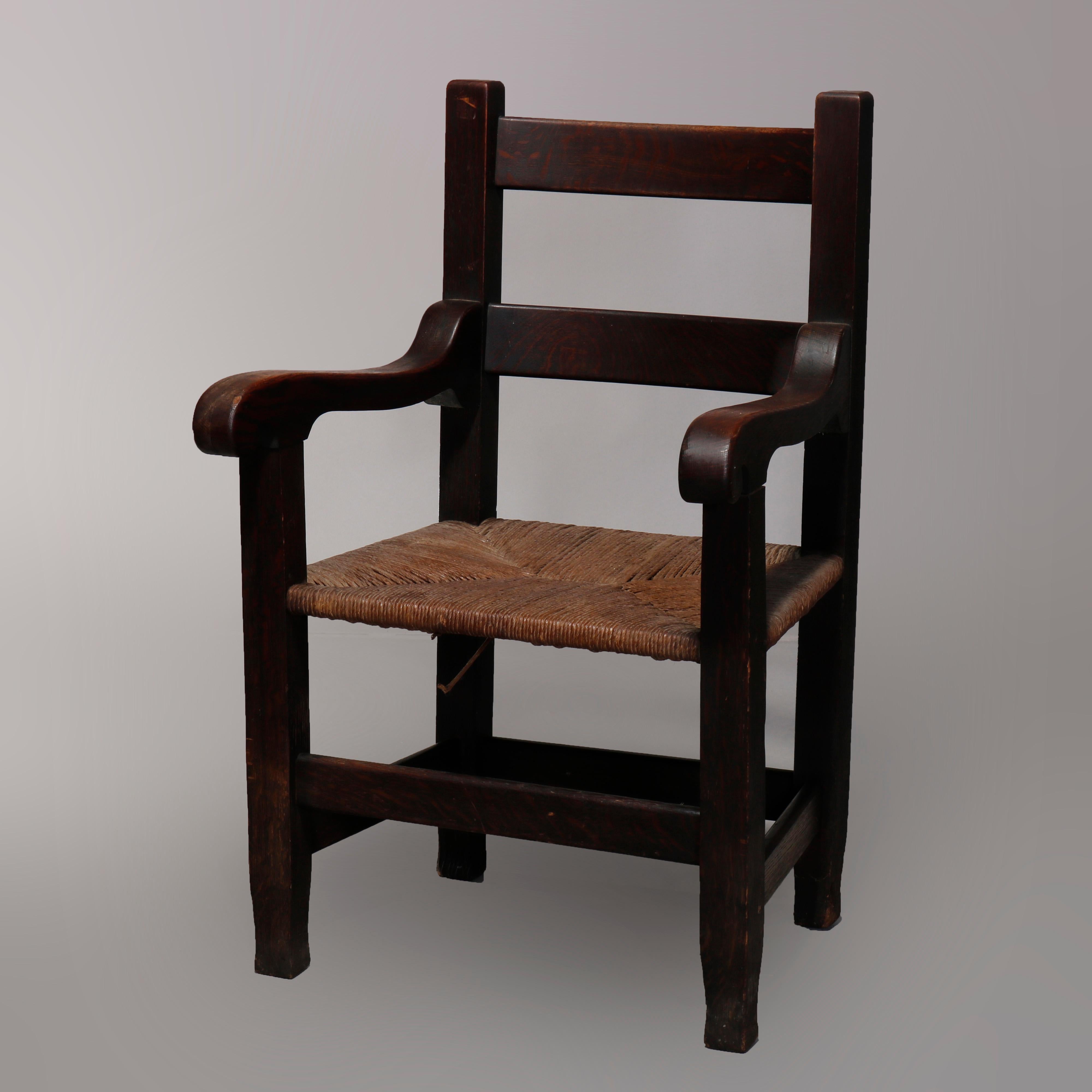 An antique pair of Arts & Crafts Mission armchairs attributed to Joseph McHugh offer quarter sawn oak construction with ladder backs, shaped arms, rush seats and raised on MackMurdo feet, unsigned and guaranteed McHugh, circa 1910.

Measures: 39.5