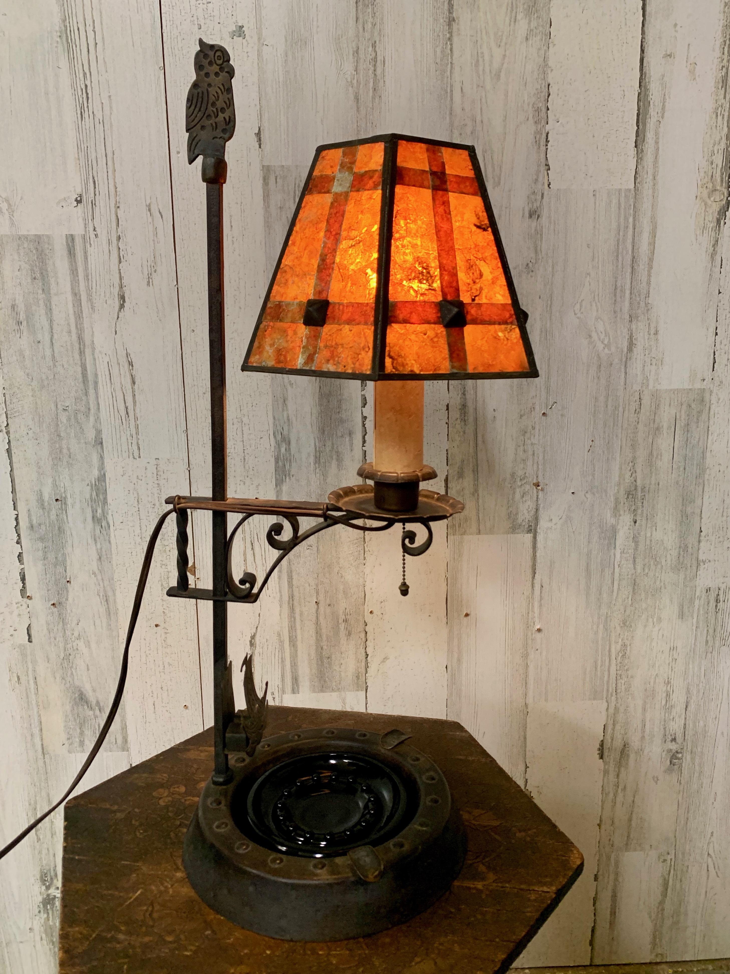 Hand craft metal lamp with glass dish and owl over looking from its perch and match holder signed 