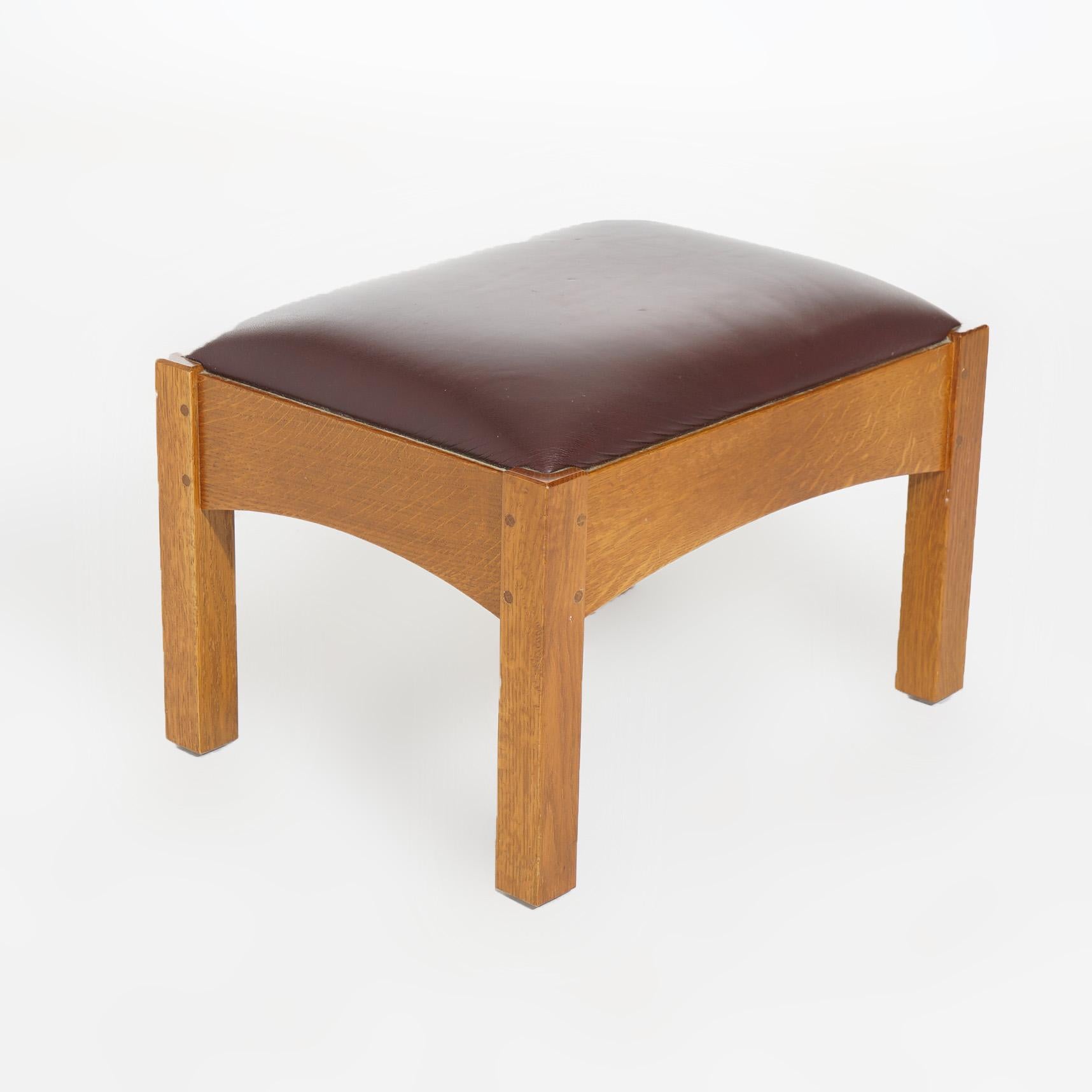 ***Ask About Discounted In-House Shipping***
An Arts & Crafts style Mission footstool by L&JG Stickley offers upholstered seat on oak frame having arched skirt, square legs and maker label as photographed, 20th century

Measures - 15