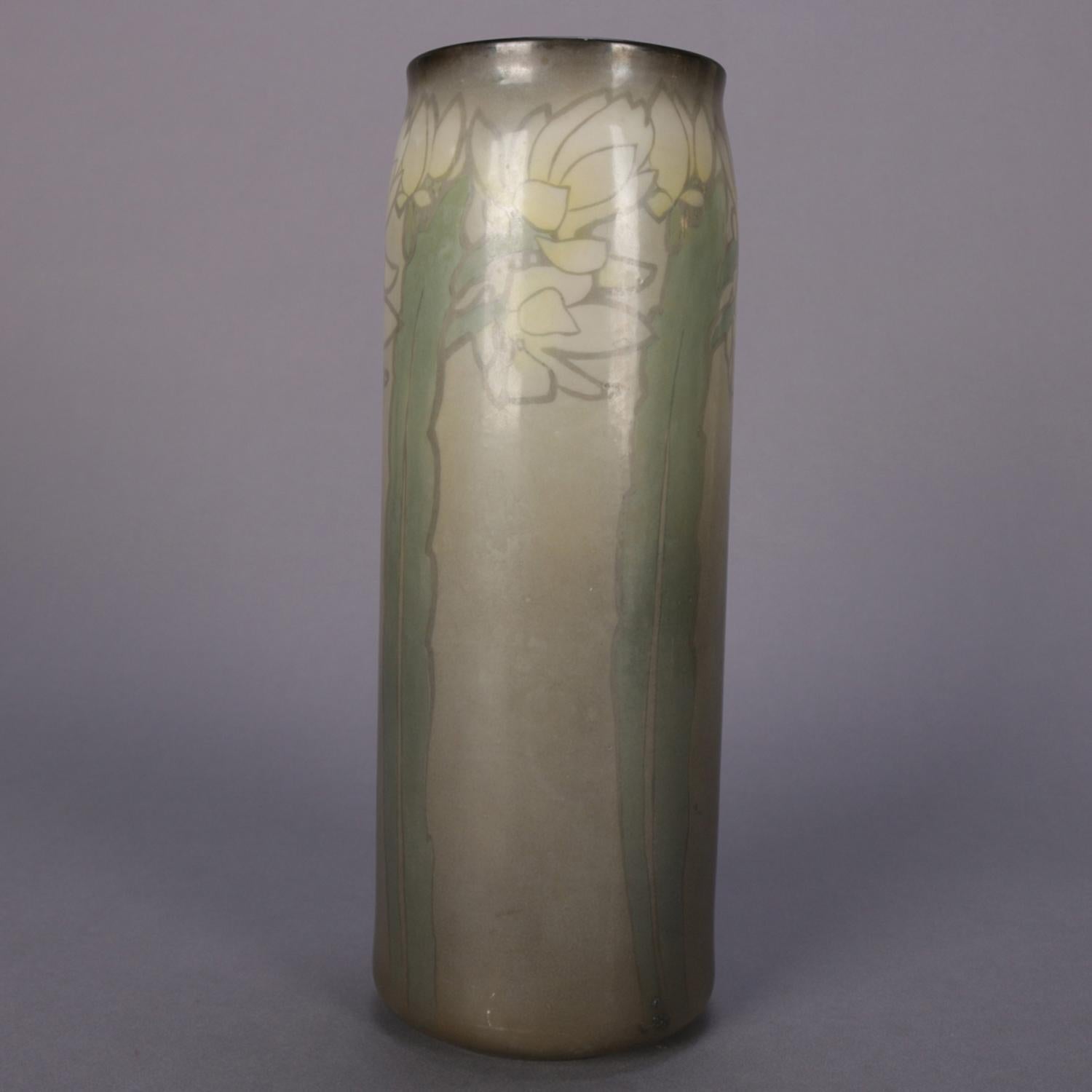 An antique Arts & Crafts marblehead school art pottery vase by Belleek featuring cylinder form with stylized floral motif, artist signed Wik and Belleek stamp on base, reminiscent of rookwood, circa 1910

Measures: 11.25