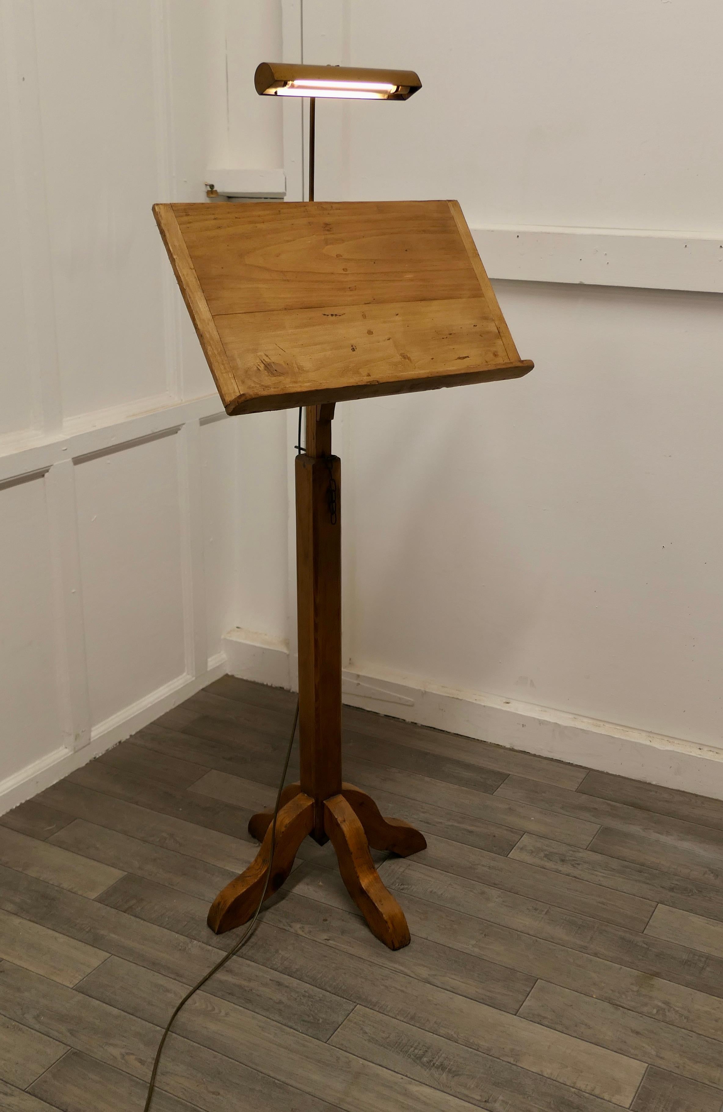 Arts & Crafts Menu Podium, Maître d' stand with reading lamp 

This is a charming piece full of character, it is tilted and a good size to hold menus with a light above the book holder
The Stand is set on a chunky X shaped Pitch Pine base which