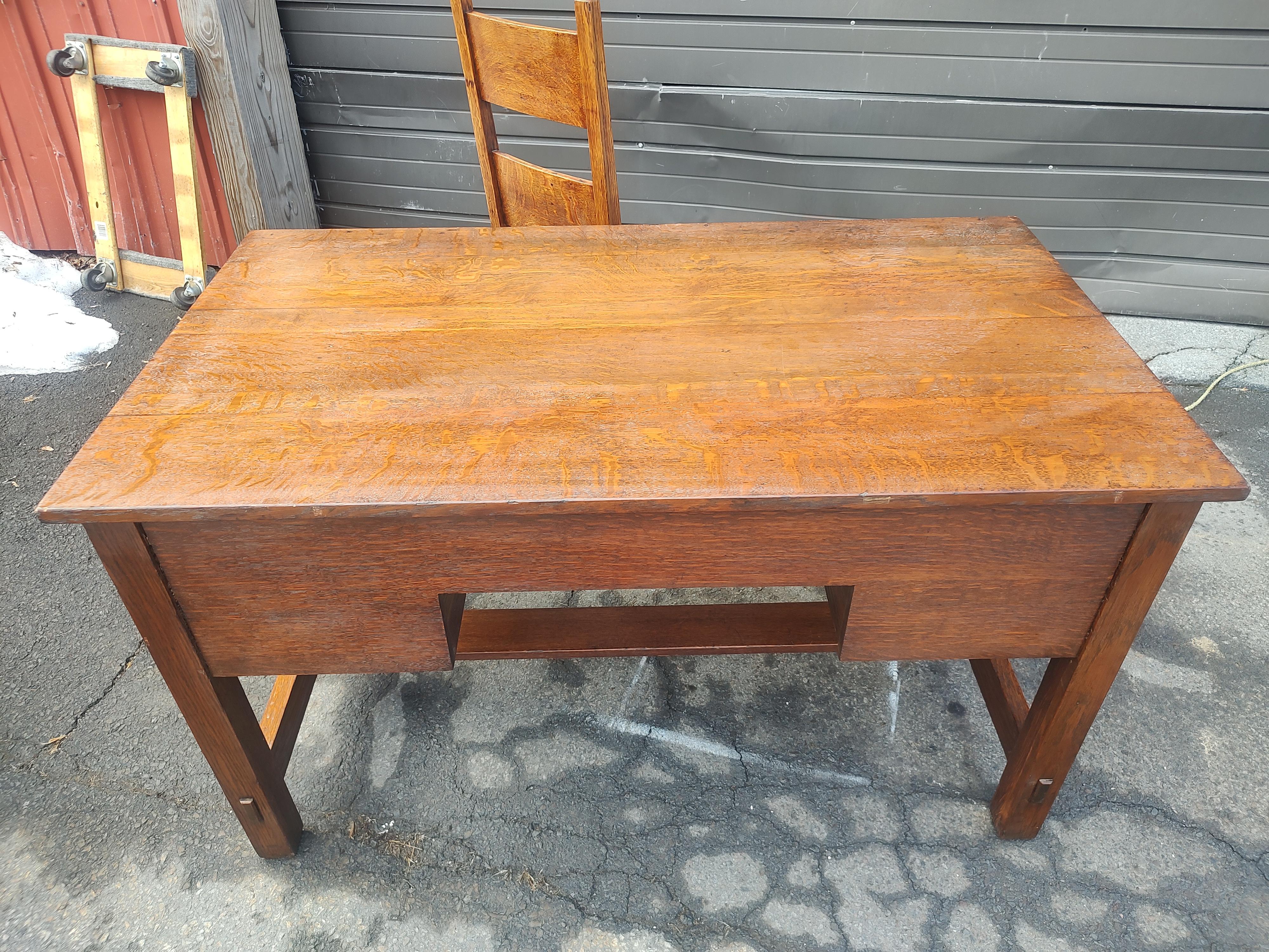 Fabulous mission Oak Arts & Crafts 3 drawer desk with a horizontal slat back desk chair with a rush seat. One long drawer over two short drawers. Both pieces are all quarter sawn oak and in excellent antique condition with minimal wear. Very tight