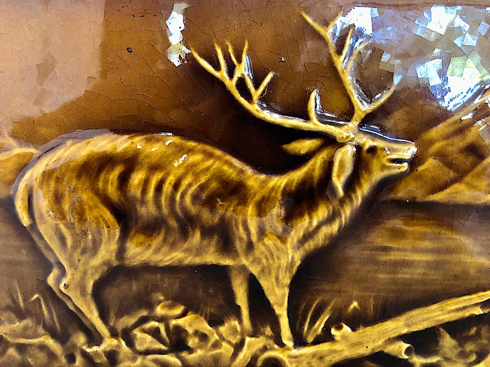 This rarely available Arts & Crafts-period glazed tile features a stag standing on the lakeshore against a mountain backdrop. Its more-than-foot-long size makes it ideal for placement as the center tile in a fireplace surround or as a backsplash.

