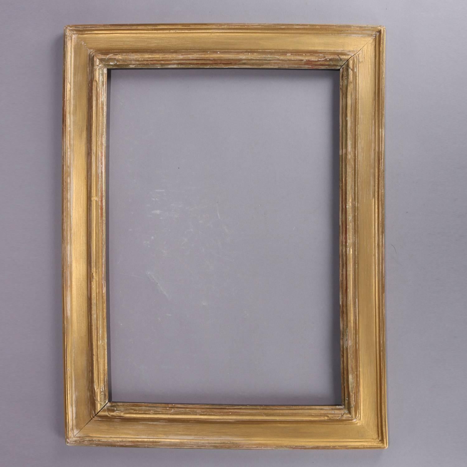Pair of matching antique Arts & Crafts genuine Newcomb-Macklin art picture frames feature giltwood construction with traditional simple form and lines and carved decoration, original label reads 