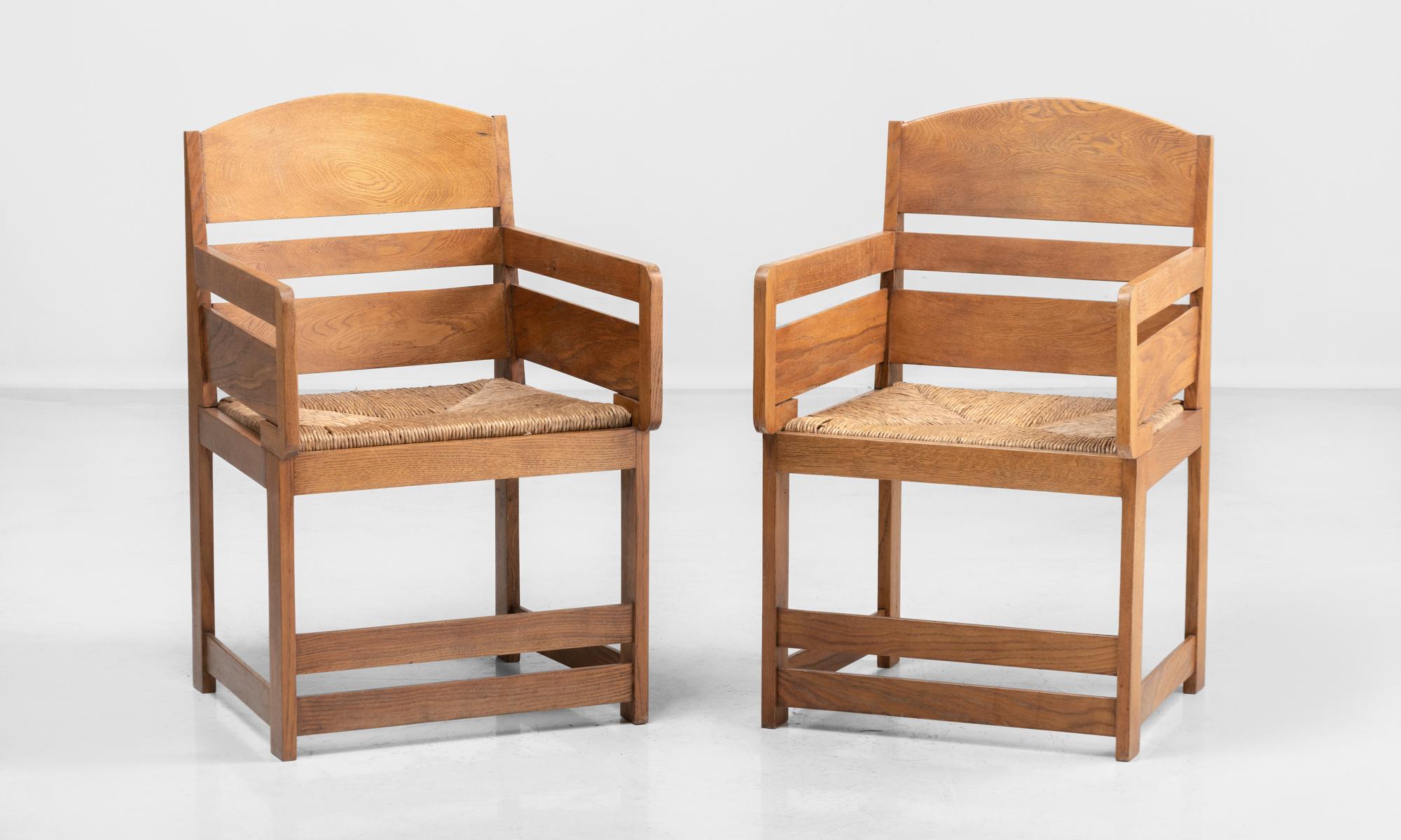Arts & Crafts oak armchairs, Netherlands, circa 1920.

Arched back with horizontal splats above a rush seat.