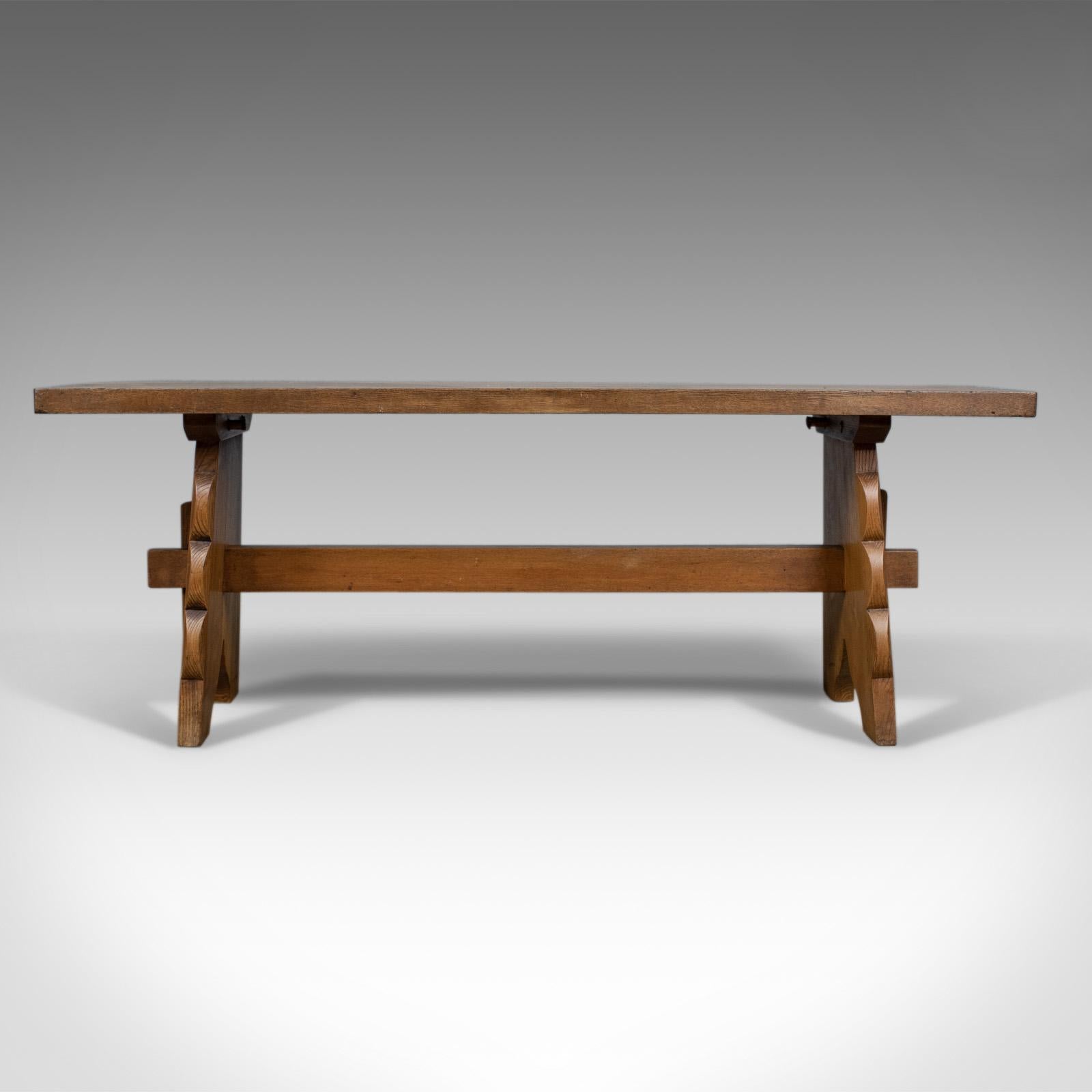 This is an Arts & Crafts oak bench, an English, early 20th century, two-seat form.

Crafted in select oak
Displaying good grain detail in a wax polished finish
In good proportion, solid, stable and practical
Modestly decorated with curved
