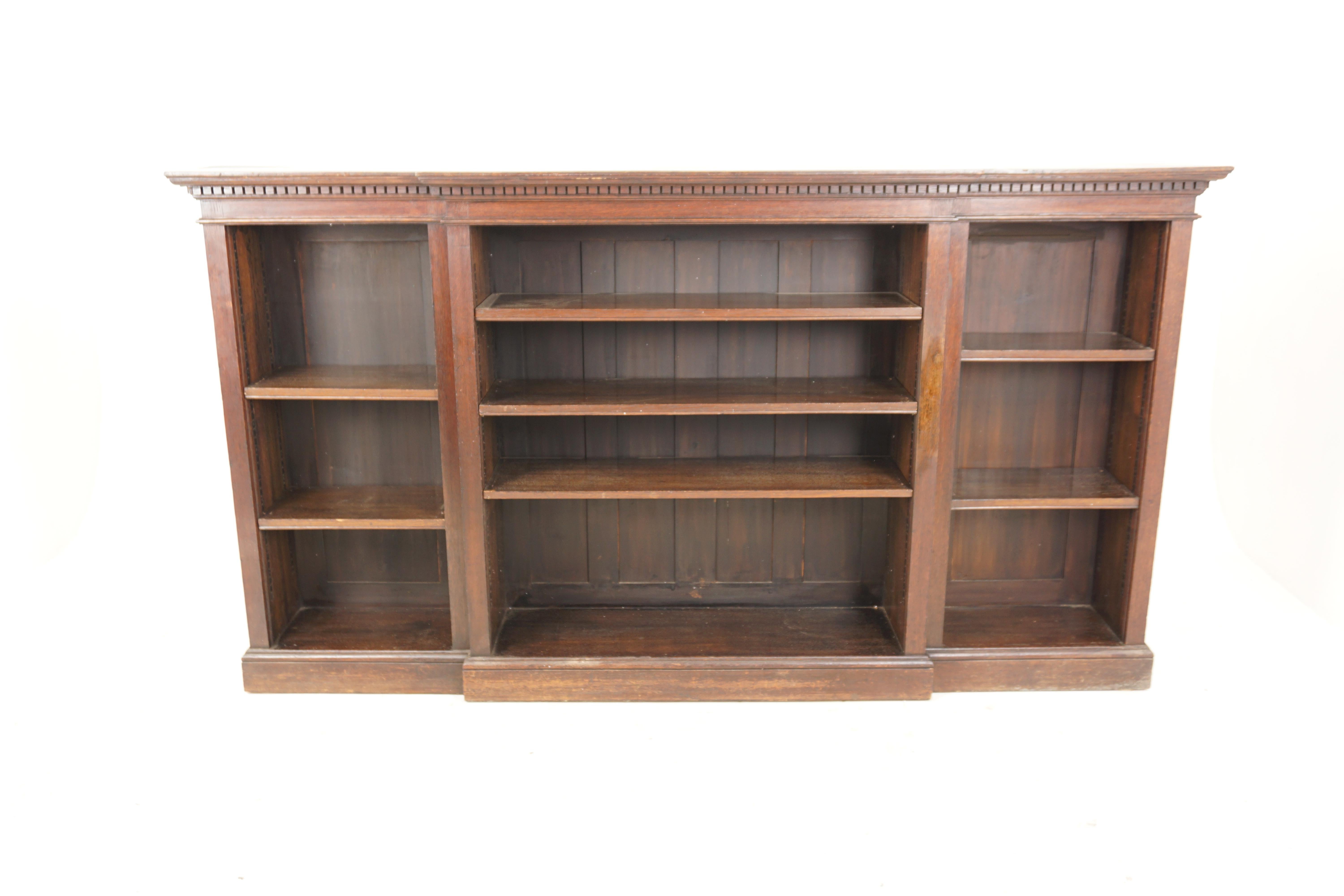 Antiques Arts + Crafts Oak Breakfast Open Bookcase Display Cabinet, Scotland 1910, H636

Scotland 1910
Solid Oak
Original Finish
Rectangular moulded top with dentil frieze below three sections. Each one fitted with central Breakfront with three