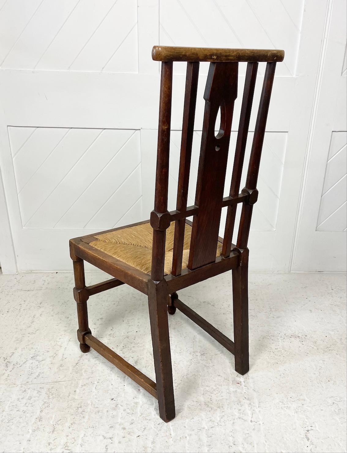 Early 20th Century Arts & Crafts Oak Chair With Rush Seat For Sale