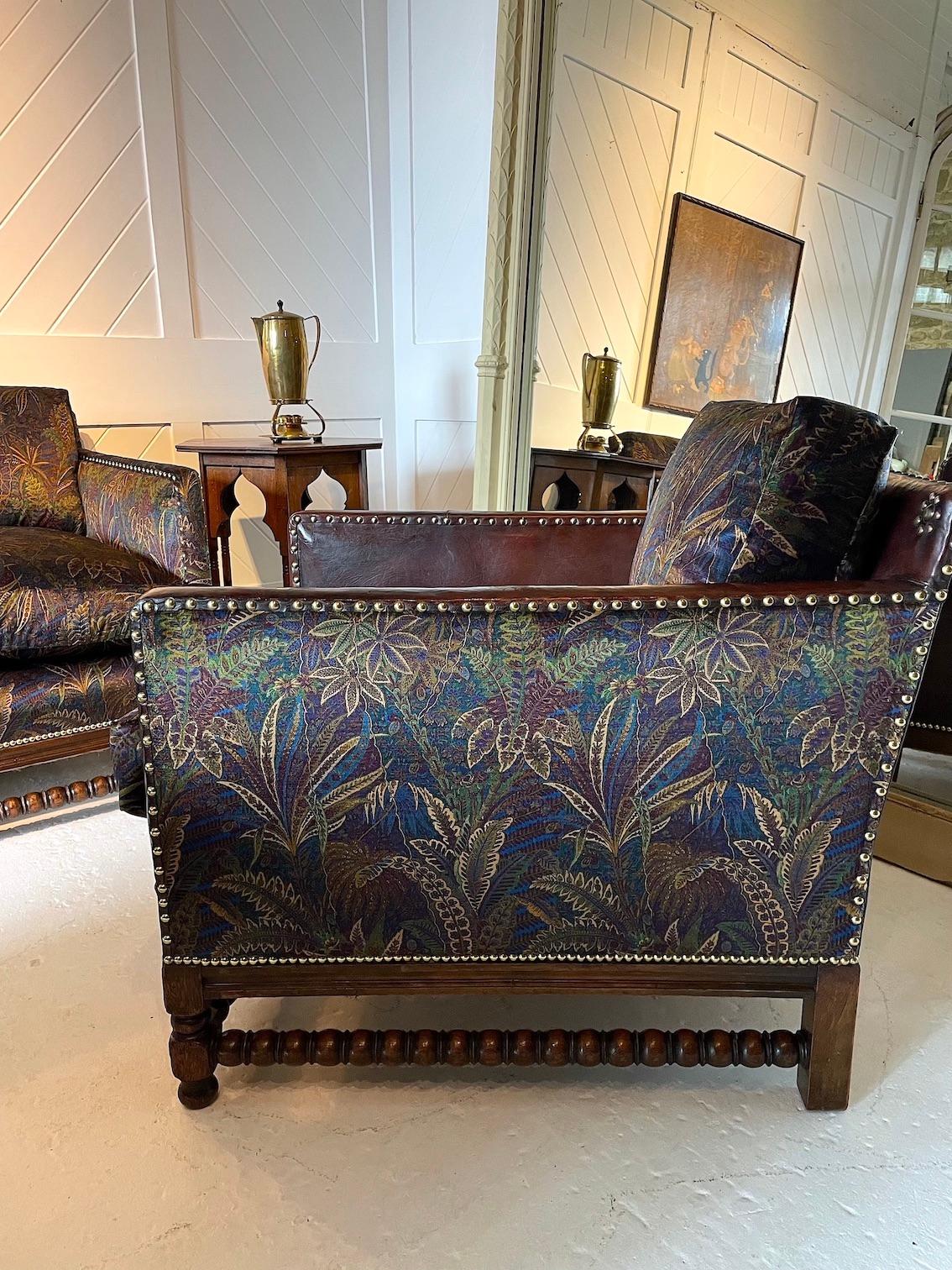 Exceptional quality oak framed, bobbin turned armchair with decorative brass stud work.
Original leather with re-upholstery using Liberty velvet fabric ‘Shand Voyage, Winter’
This was possibly retailed by Liberty & Co
circa 1915

Matching