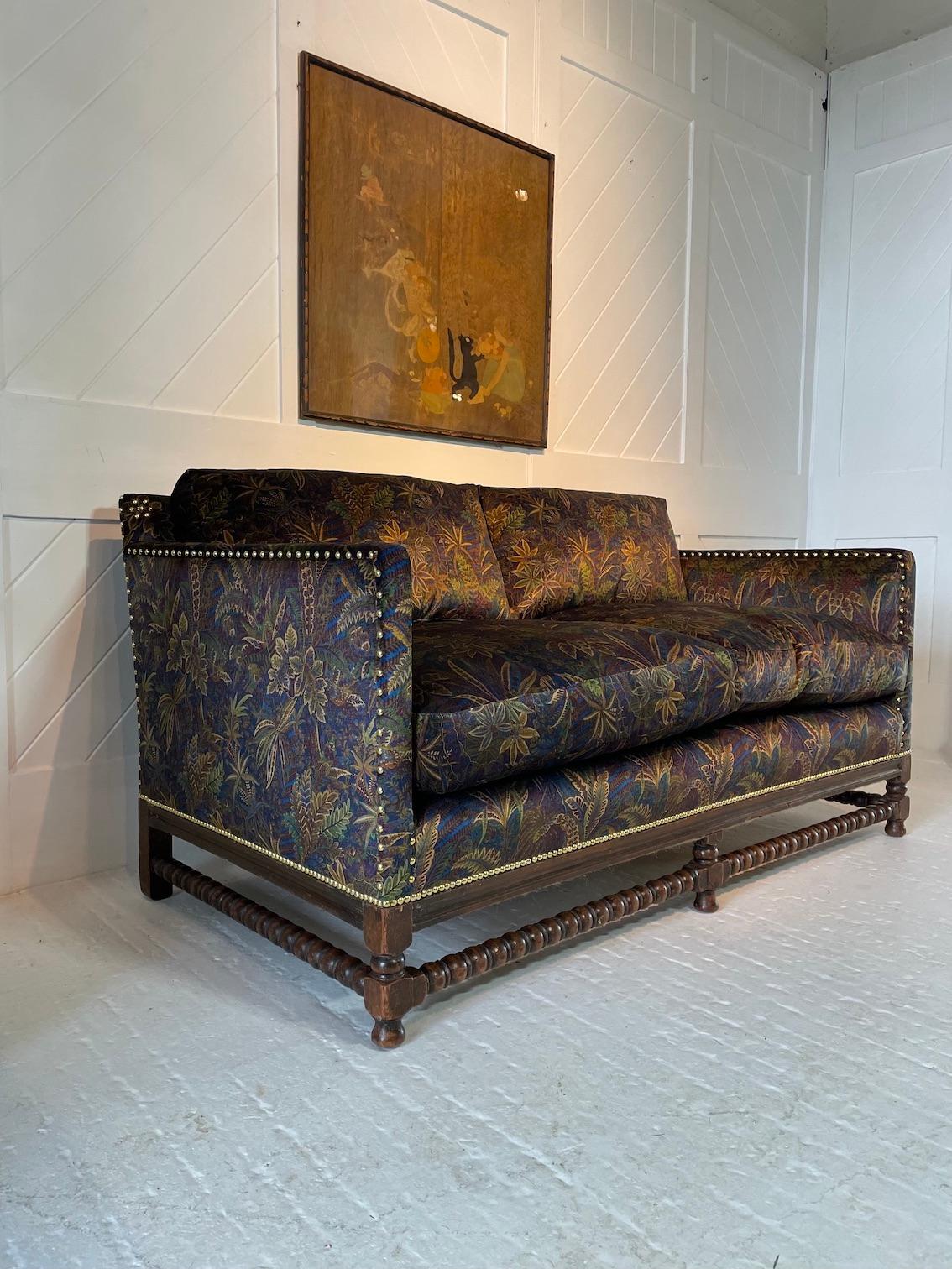 Exceptional quality oak framed, bobbin turned settee with decorative brass stud work.
This settee has been re-upholstered with Liberty velvet fabric ‘Shand Voyage, Winter’
This was possibly retailed by Liberty & Co
circa 1915.

   
