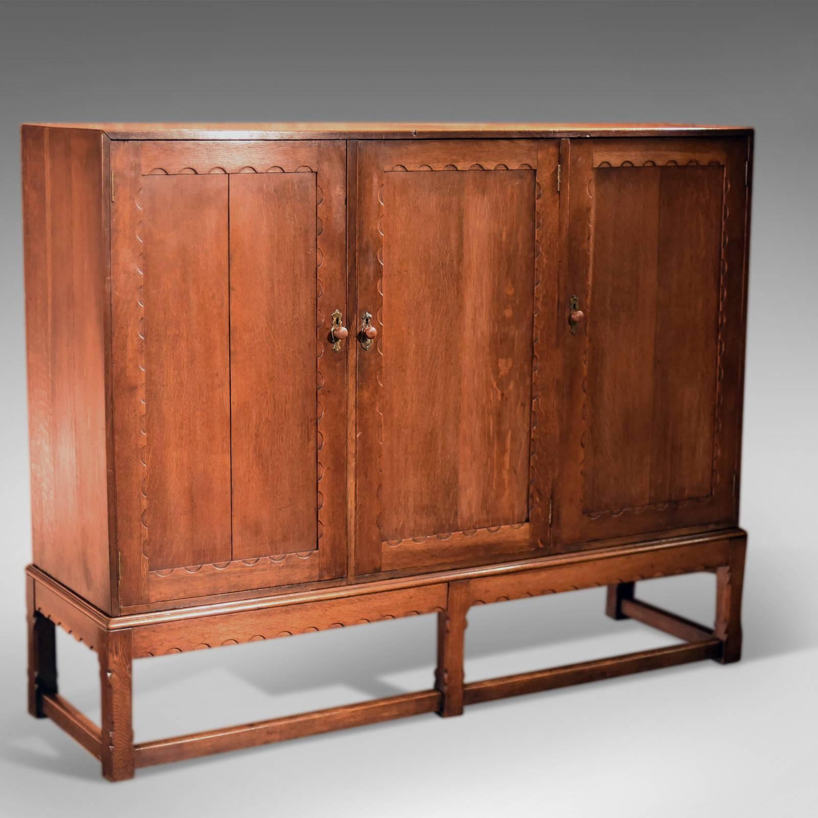 This is an antique, English, Victorian oak larder on stand dating to circa 1900.

In Classic Arts & Crafts styling and of Liberty quality this oak cabinet displays beautifully with medullary rays and a fine waxed finish. A substantial piece of
