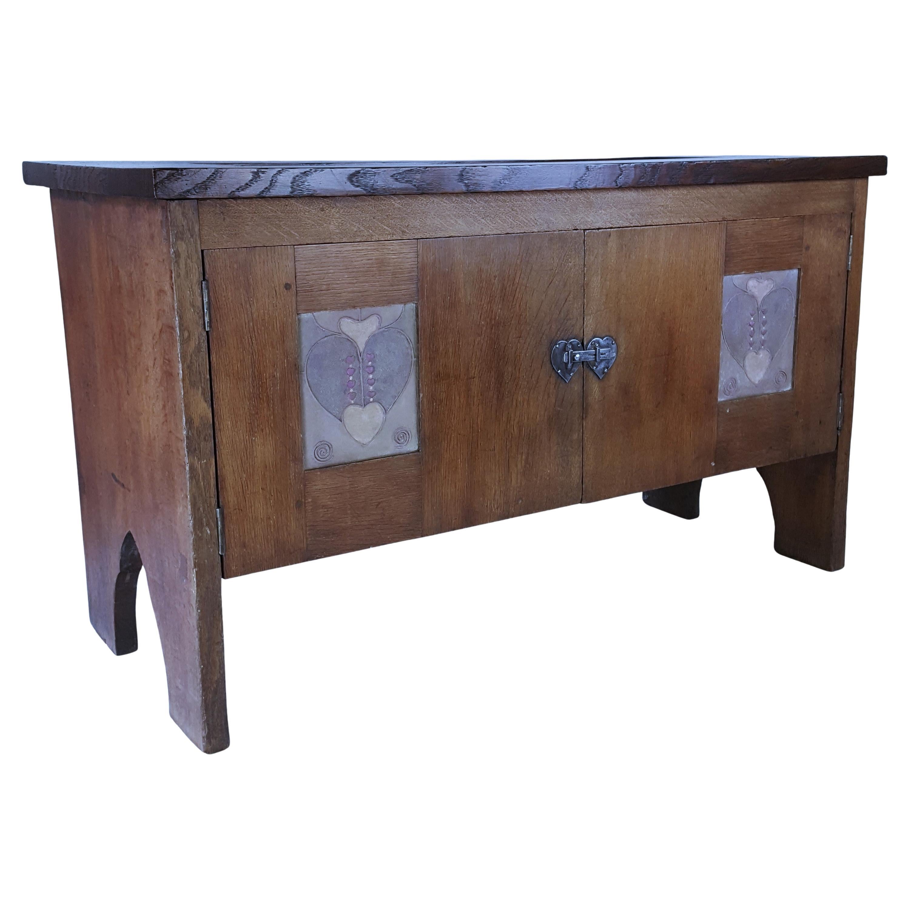 Arts & Crafts oak low cupboard or coffer with gesso panels  attr. Henry T. Wyse