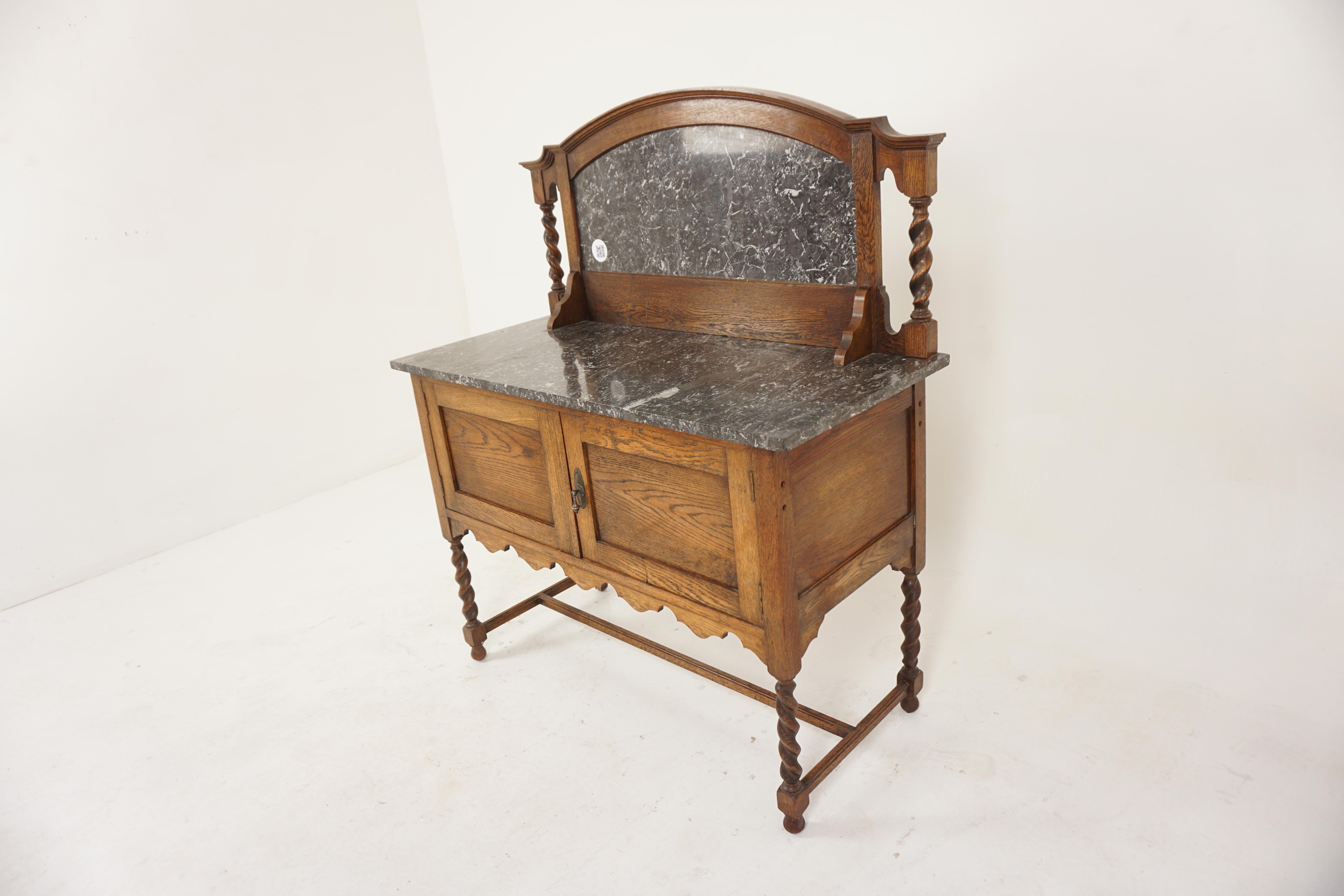 Arts + Crafts oak marble top barley twist washstand, Scotland 1910, H782.

Scotland 1910
Solid Oak
Original Finish
Attractive dome shaped back with barley twist supports on the ends.
Marble splash back.
Speckled grey and white marble