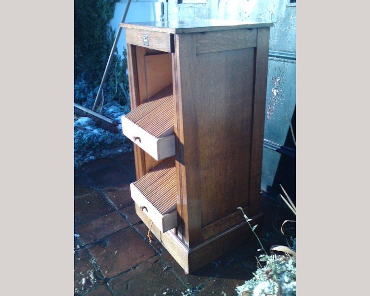 Early 20th Century Arts & Crafts Oak Record Cabinet with Slide Out Drawers for Holding, 1978 For Sale