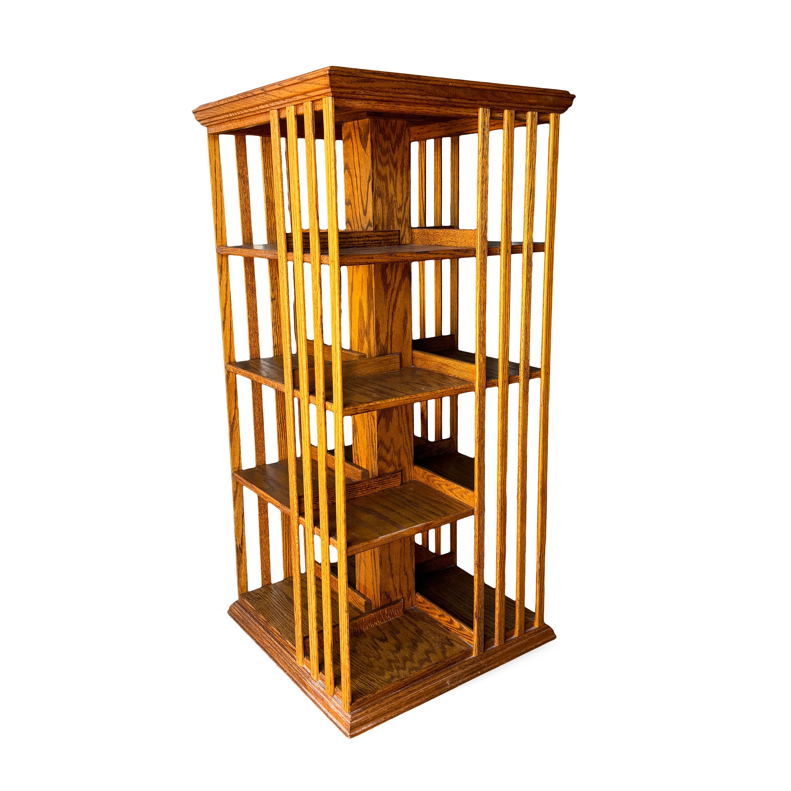 Showcase your book collection with this distinctive Mission Arts & Crafts style revolving bookcase. The bookcase is made with a slatted design, crafted from solid oak, and offers both style and practicality. This bookcase provides ample storage