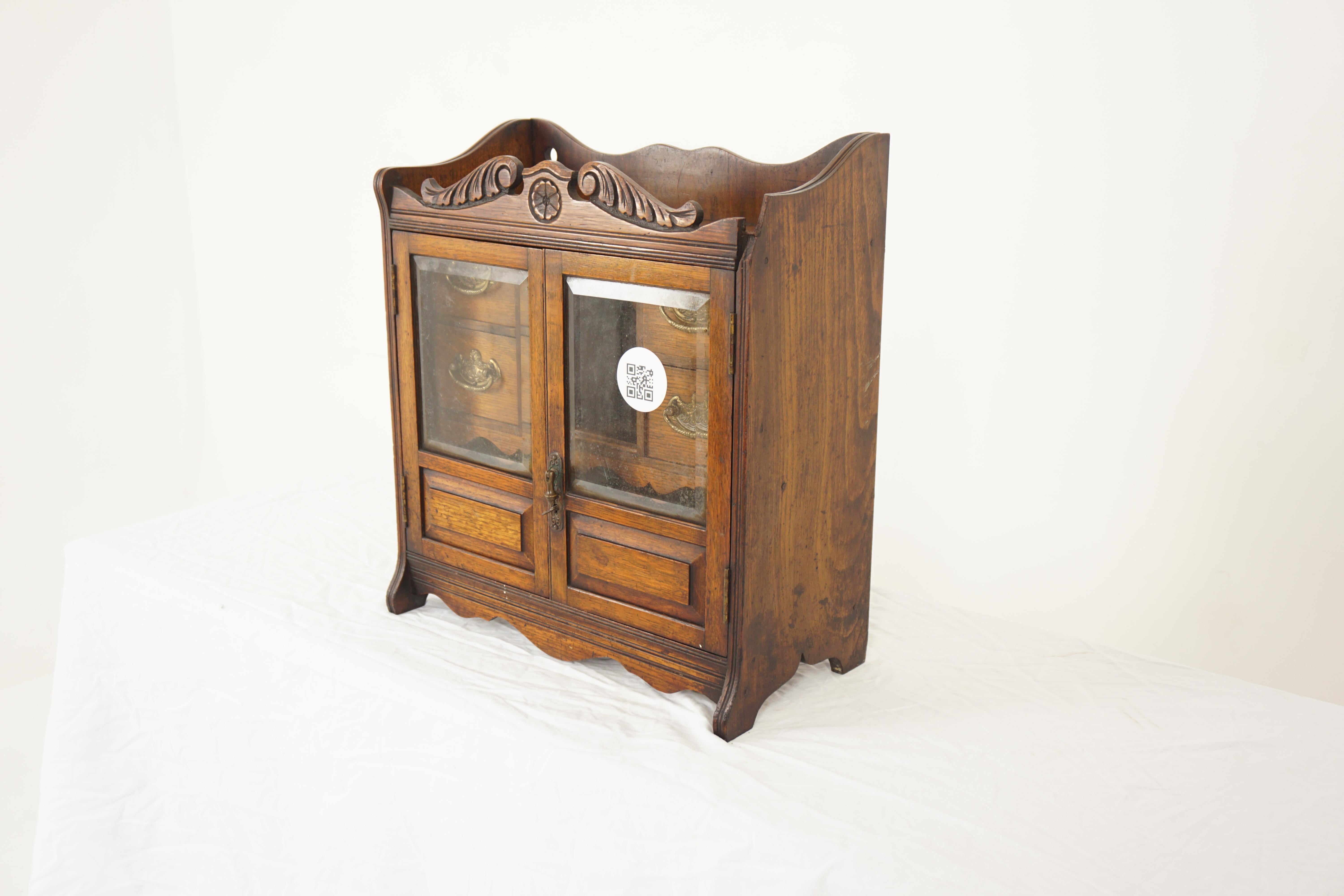 Arts & Crafts oak smokers cabinet, wall cabinet, Scotland 1900, H761

Scotland 1900
Solid oak
Original finish
Shaped gallery on the top with finials
Pair of original glass doors open to reveal fitted interior with shelves and drawers
All