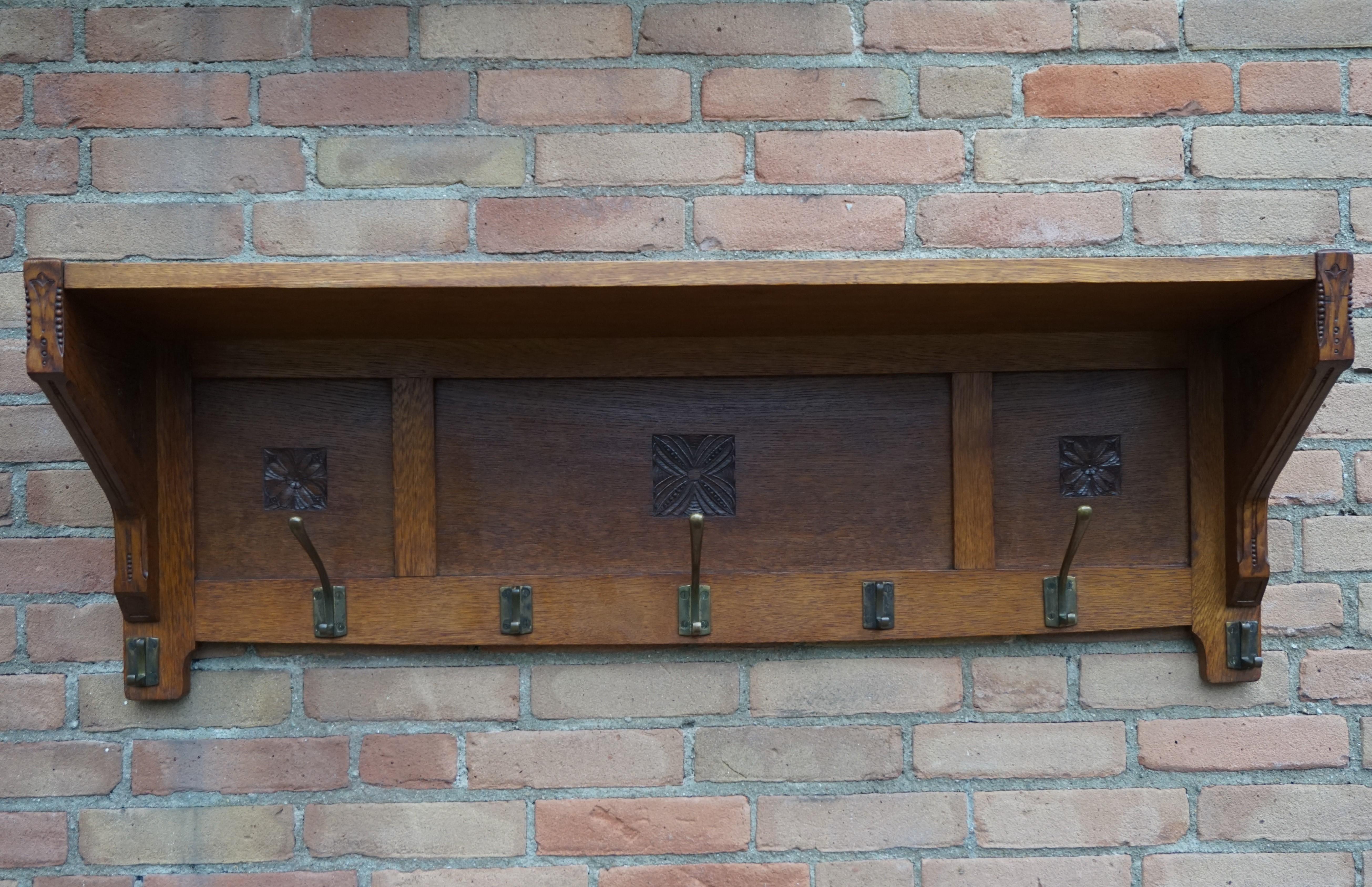 Stunning and excellent condition antique coat rack.

If you are a collector of handcrafted, early 20th century beauty then this striking antique could be gracing your entrance soon. This typical Dutch Arts & Crafts coat rack from 1900-1910 is