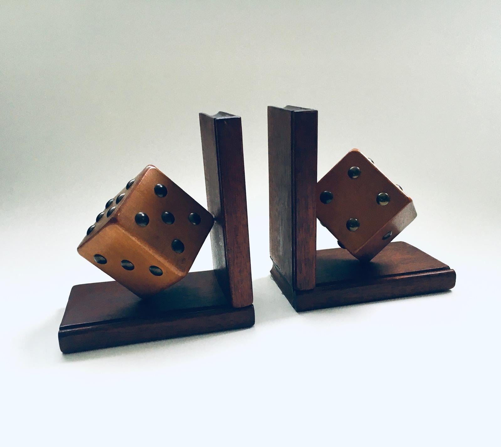 Vintage Art Deco Arts & Crafts period pair of wooden handcrafted Dice Bookends, made in Belgium 1920's. Rare and highly decorative pair of antique bookends. These handcrafted hand made bookends from the earliest years of the twentieth century are