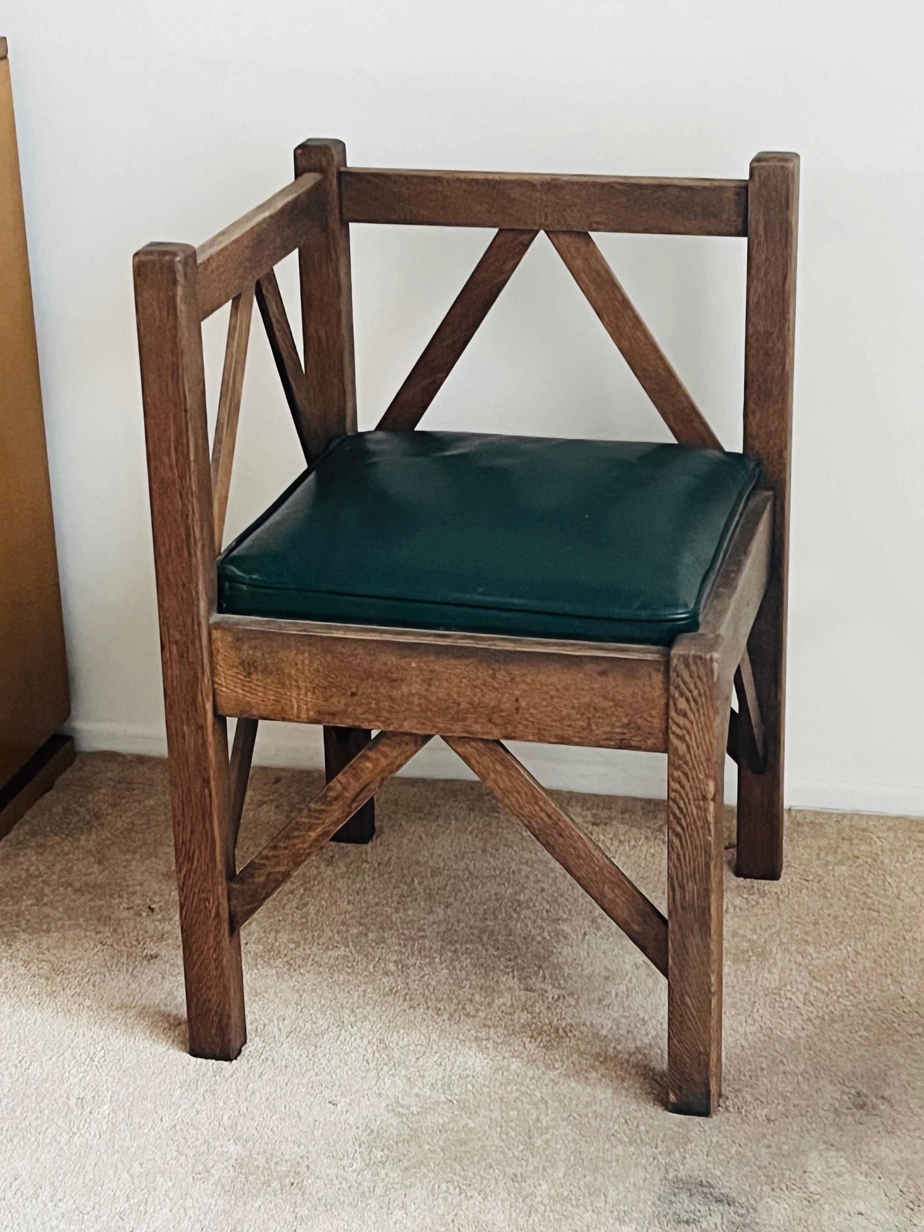 Arts & Crafts patinated oak corner chair.