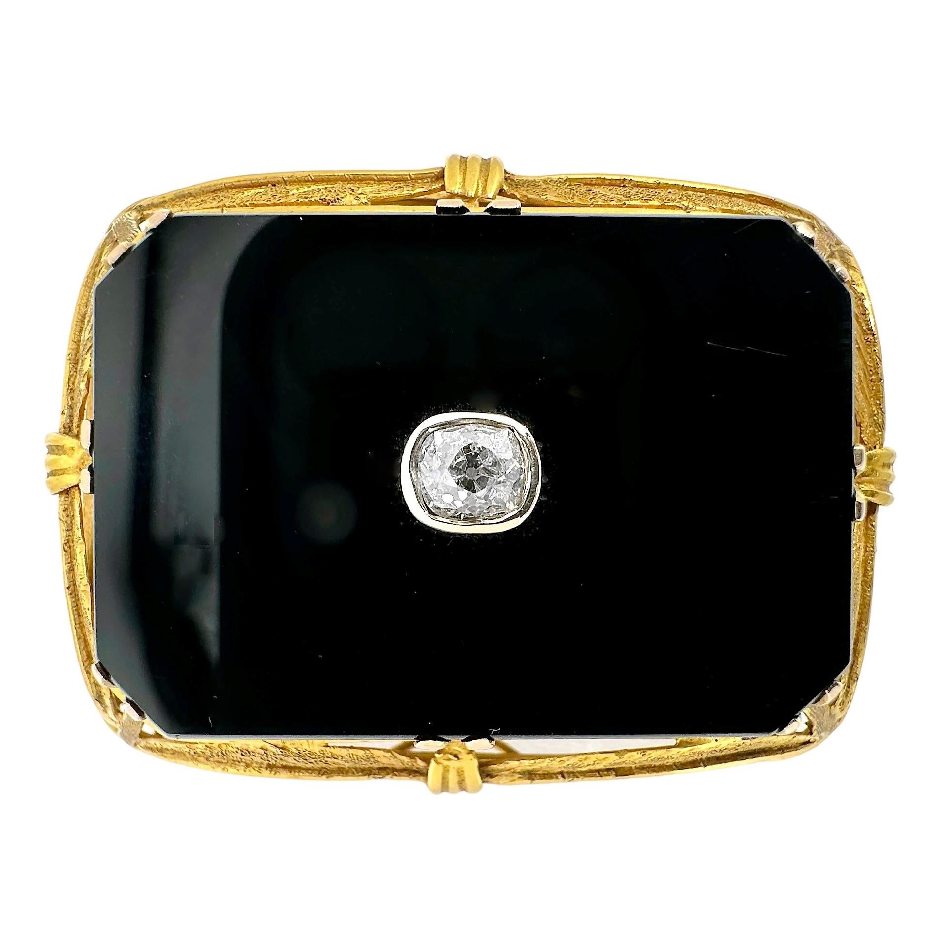 This wonderful and large Arts and Crafts Movement period 14k yellow gold, onyx, and diamond pendant/brooch, is entirely hand crafted and epitomizes aesthetic articles from that period, Based on it's style and components, we conclude that it was