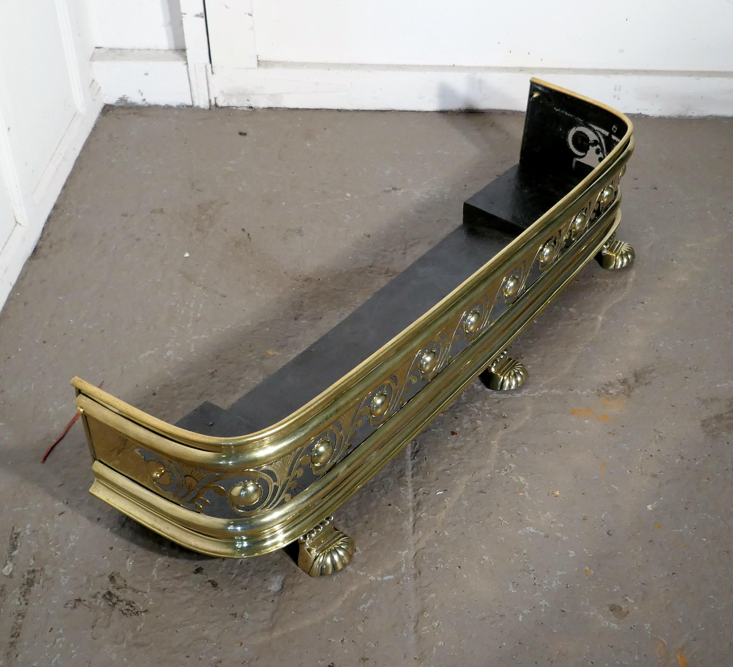 Arts & Crafts pierced brass fender

This is a Victorian pierced brass fender decorated with leaves and flower it has an iron base and stands on stylised lions paw feet
The fender is in very good condition it is 9” high, 44” long and 12”