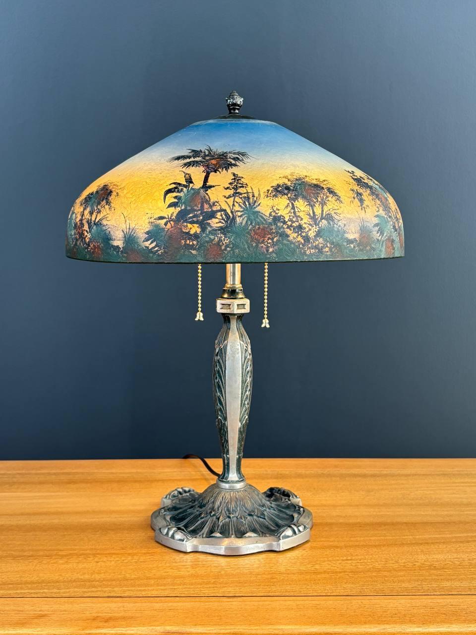 Materials: Patinated Steel, Reverse Painted Glass Shade
Style: Arts & Craft