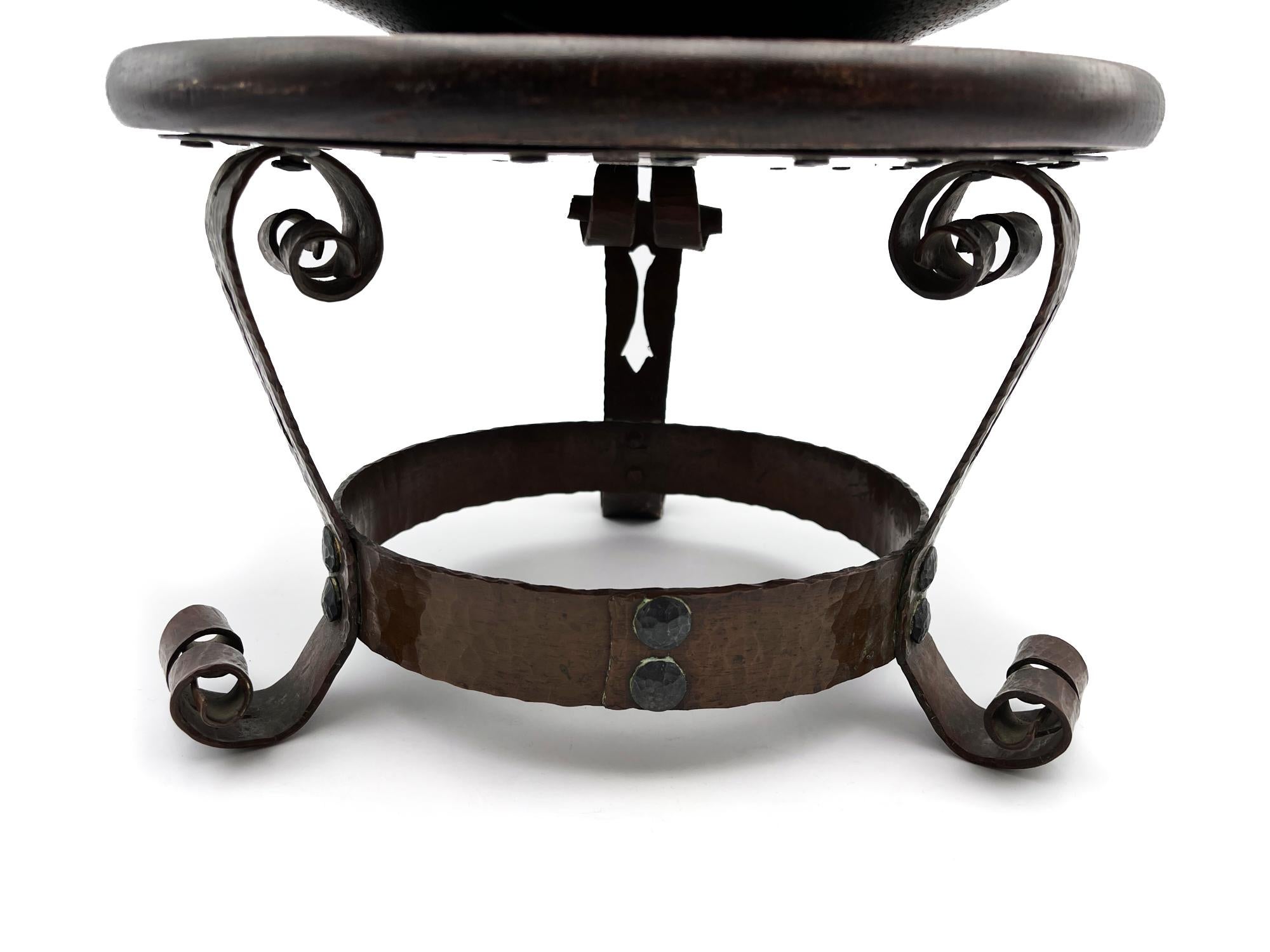 The rich oak stand has a solid copper plate base with curled copper legs and decorative nailhead detailing. It is paired with a low and lovely stylized 3 handled pottery bowl with a rich green crackle glaze and drainage hole in the bottom. (sold